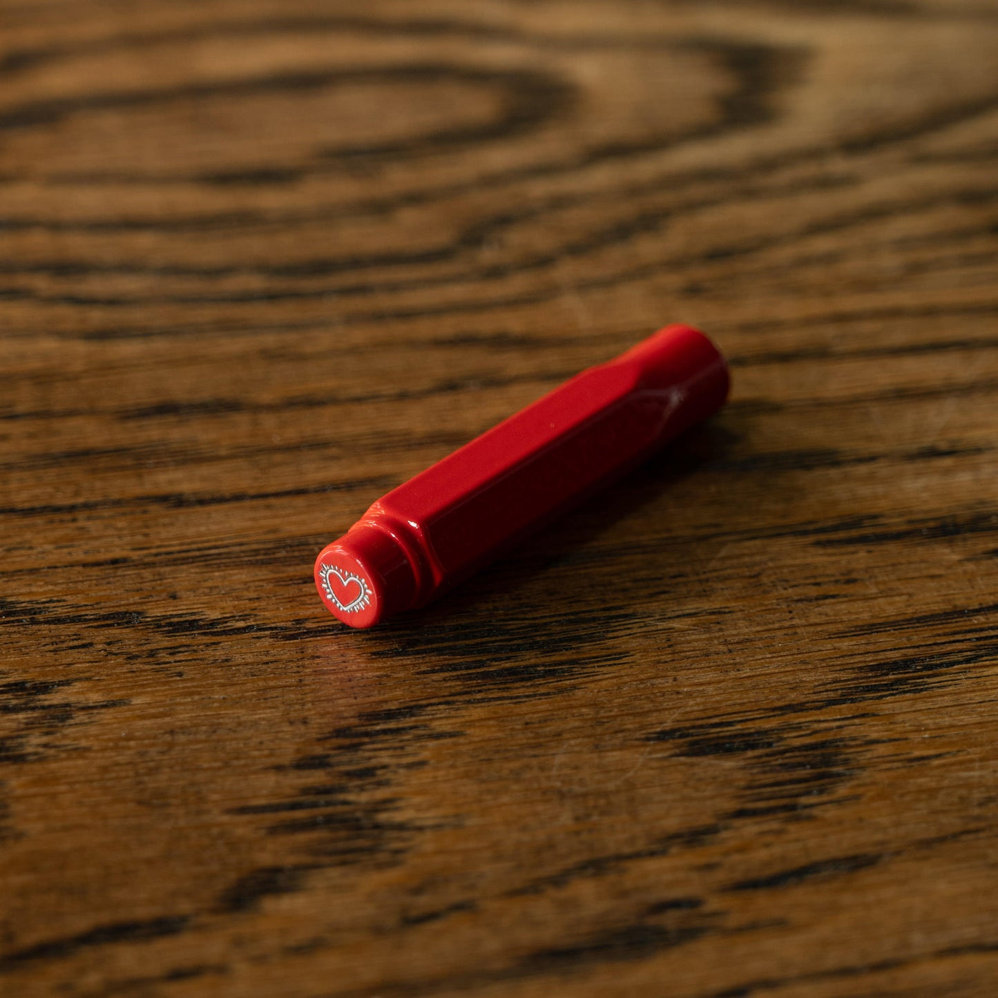 Blackwing Volume 292 Keith Haring red "Radiant Heart" point guard on a wooden surface