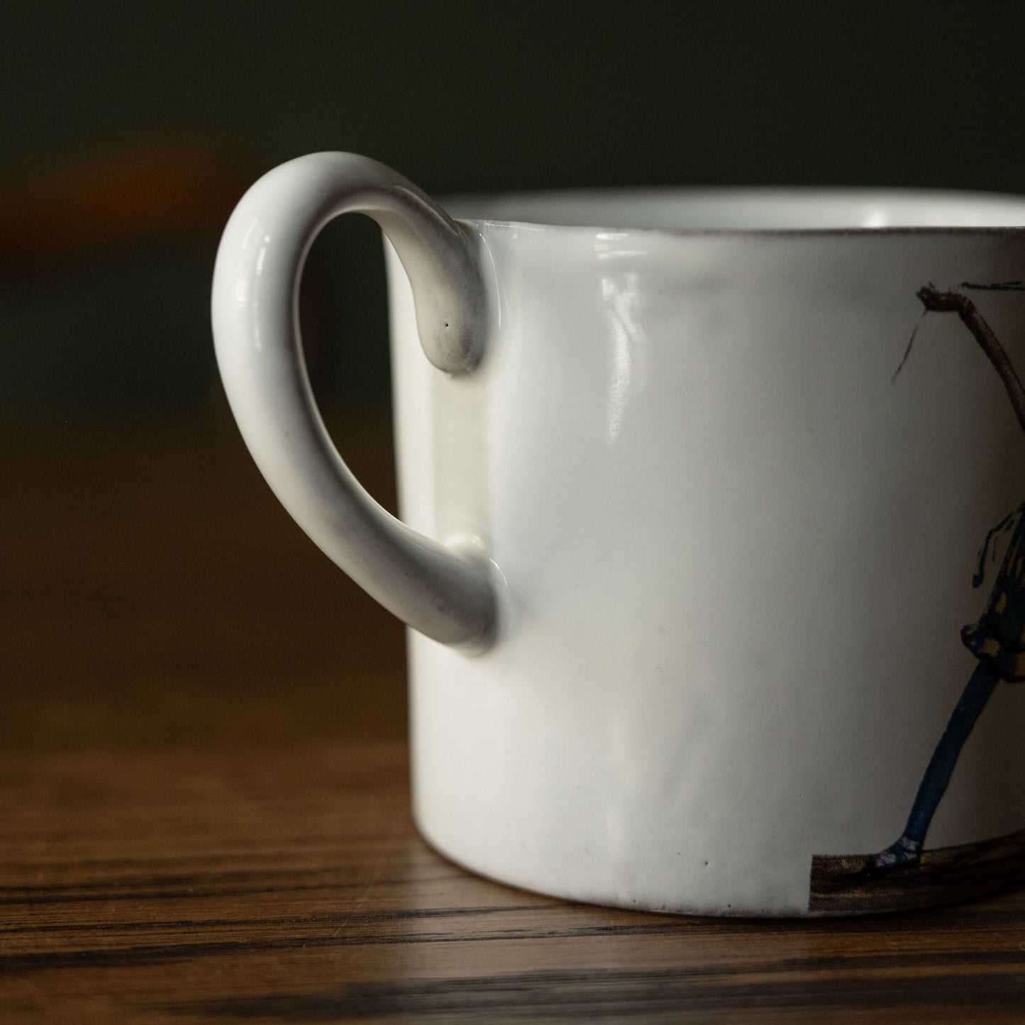 Handle of Carron Paris white Dancer illustrated mug