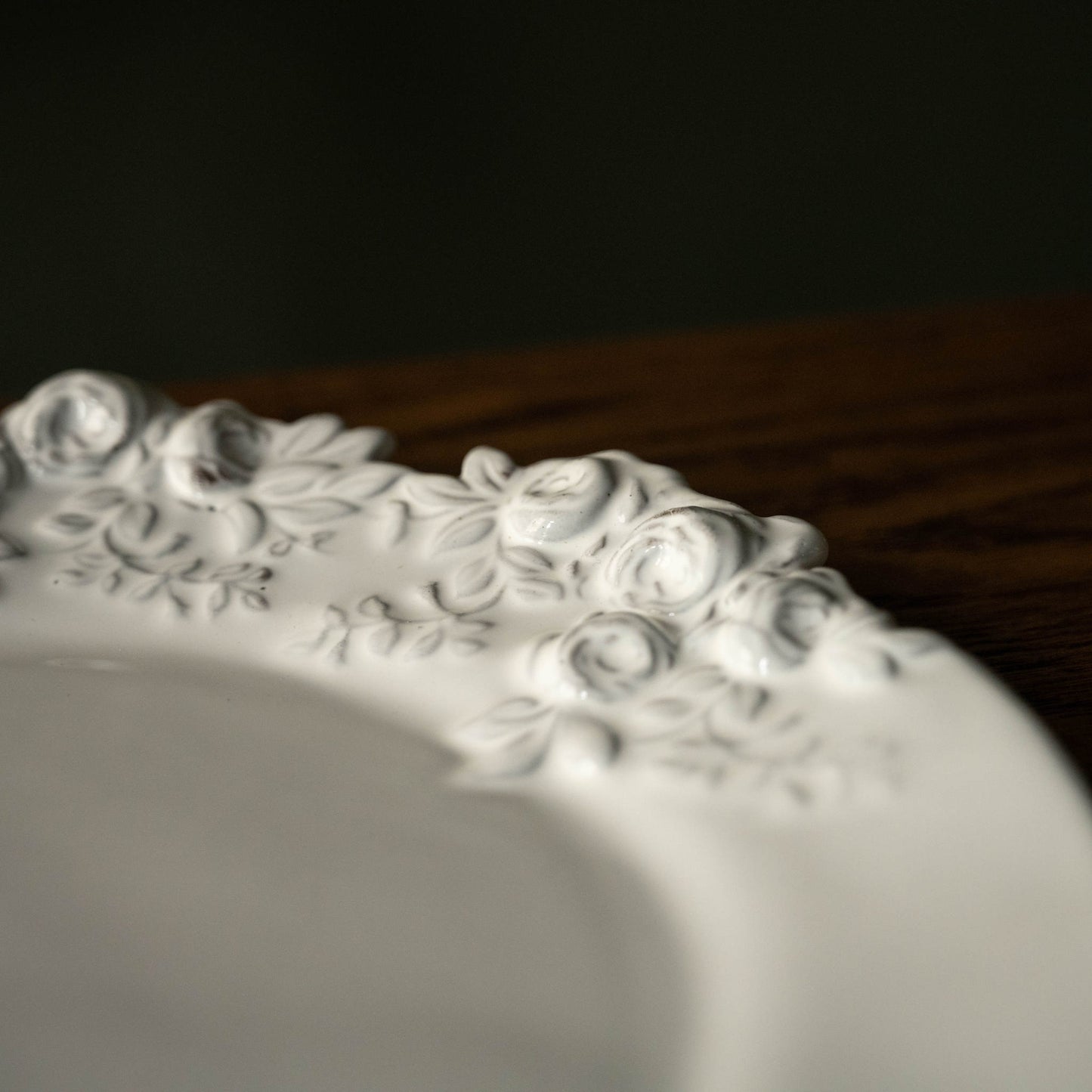 Close-up of Carron Paris white ceramic plate with Rose floral pattern