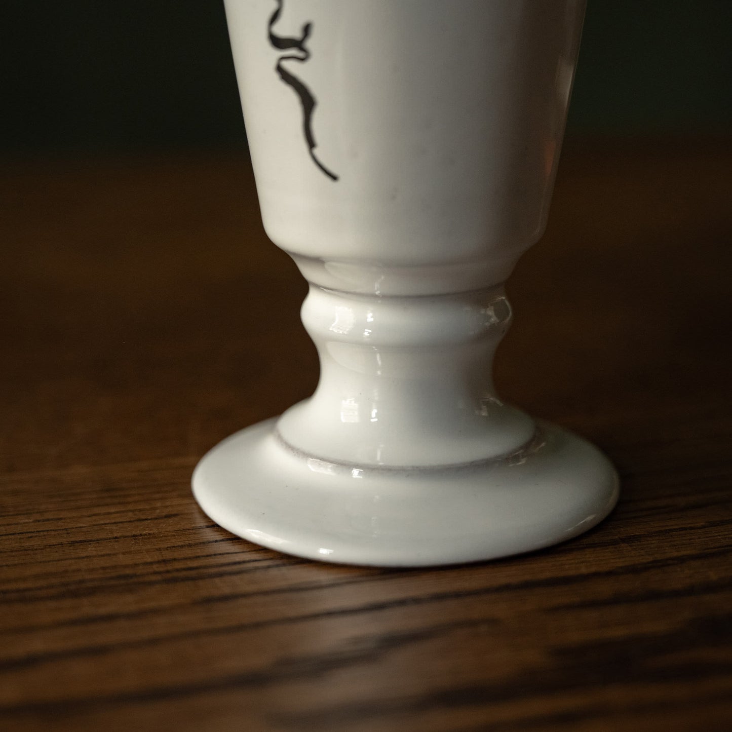 Footed base of Carron Paris small white ceramic vase