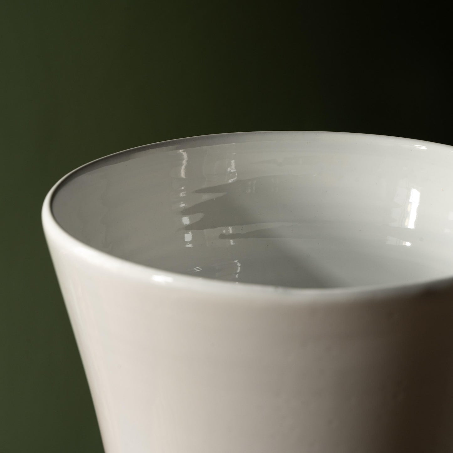 Rim and inside of Carron Paris medium sized footed vase.