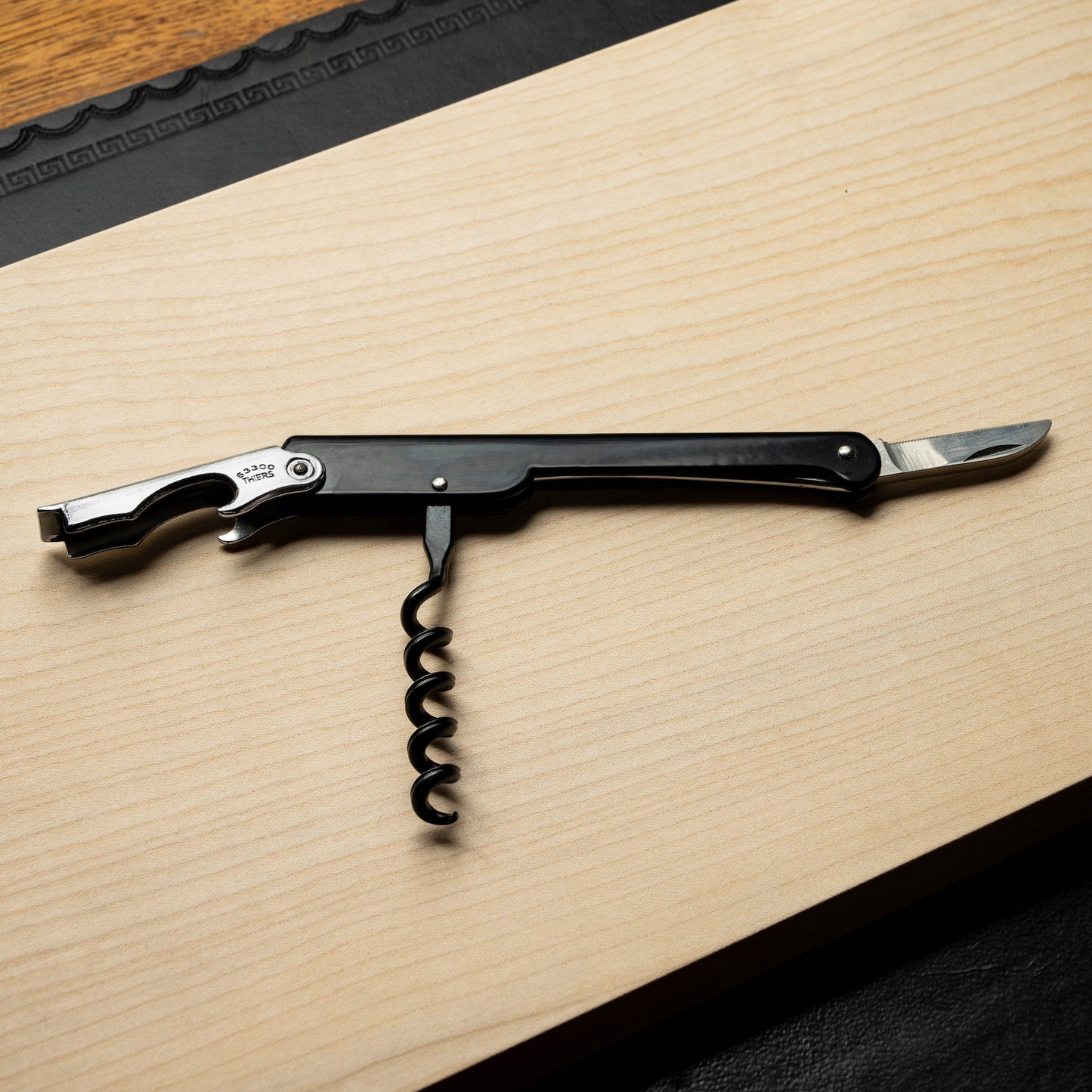Cartailler Deluc Corkscrew with bottle opener, screw & serrated blade all open.