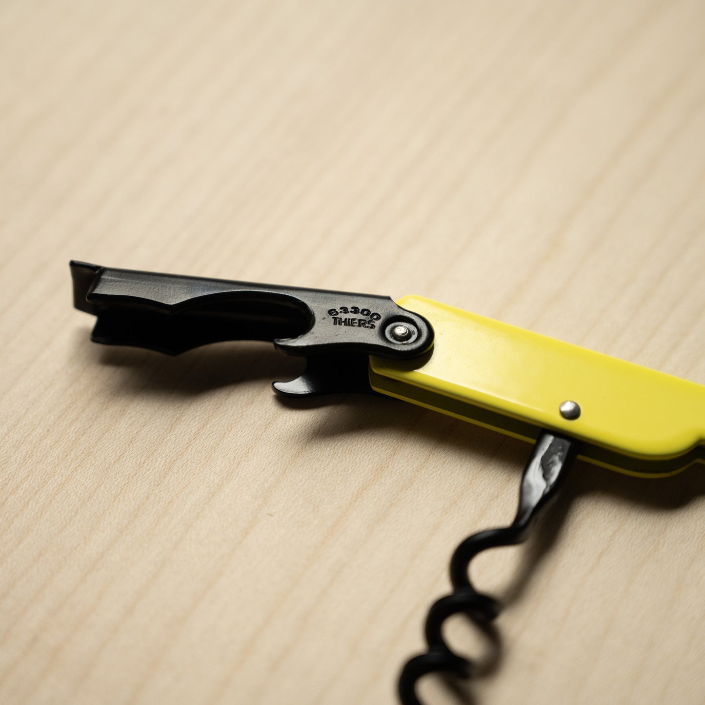 Yellow Cartailler Deluc Corkscrew with Black Bottle Opener tool.