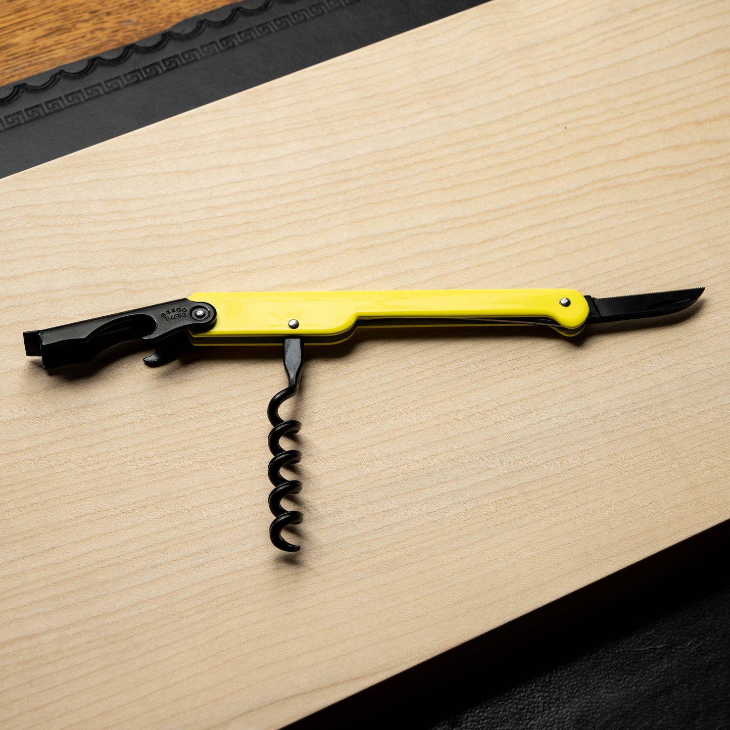 Yellow Cartailler Deluc Corkscrew wit all tools open.
