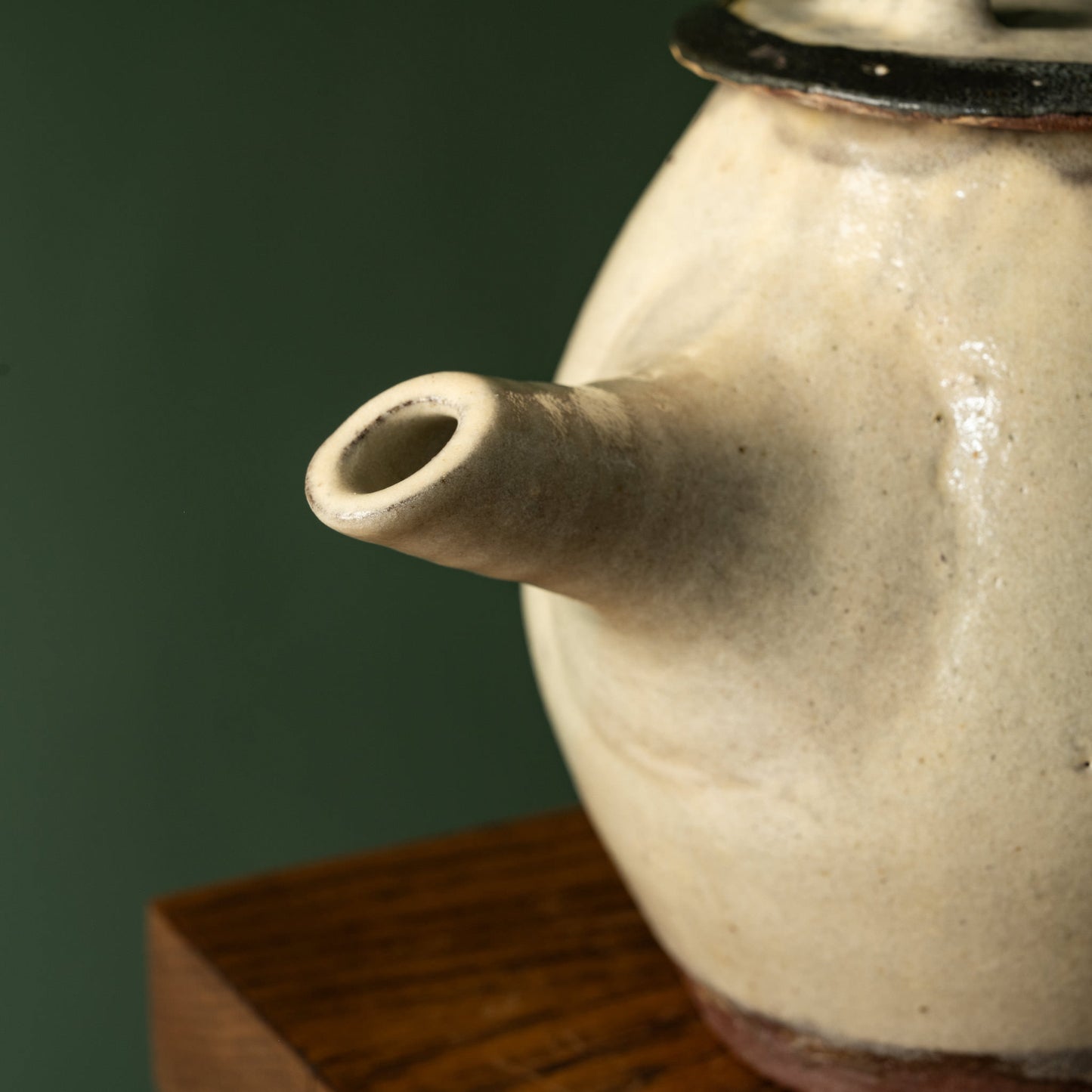 Close-up of Joshua Williams earthenware cream teapot spout