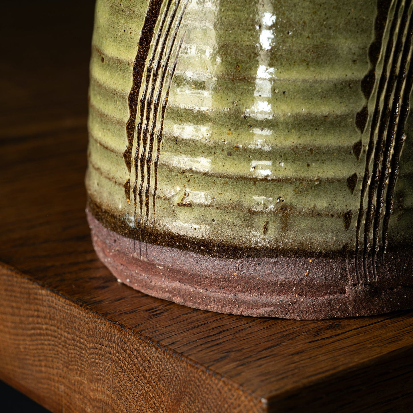 Close-up of Joshua Williams green glazed earthenware jug base