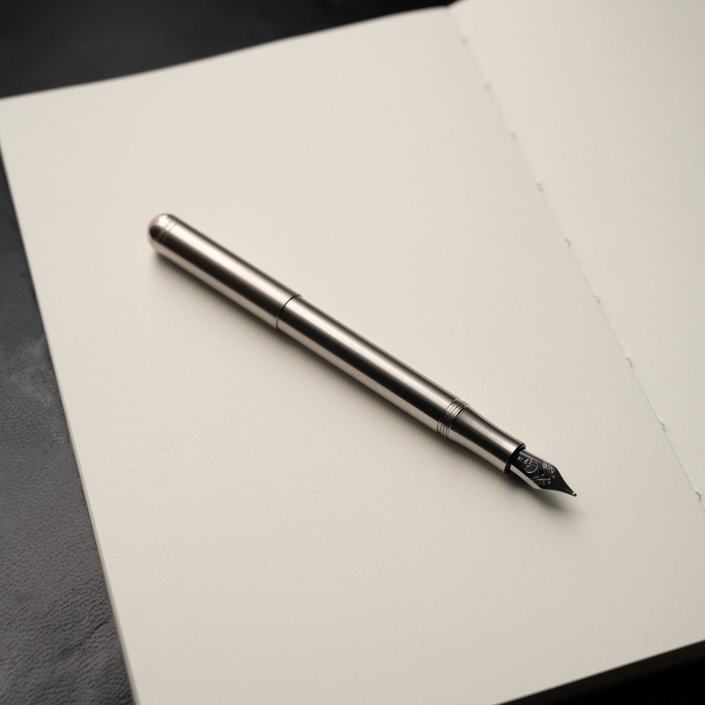 Kaweco Liliput Stainless Steel Fountain Pen with lid off and screwed on to pen base