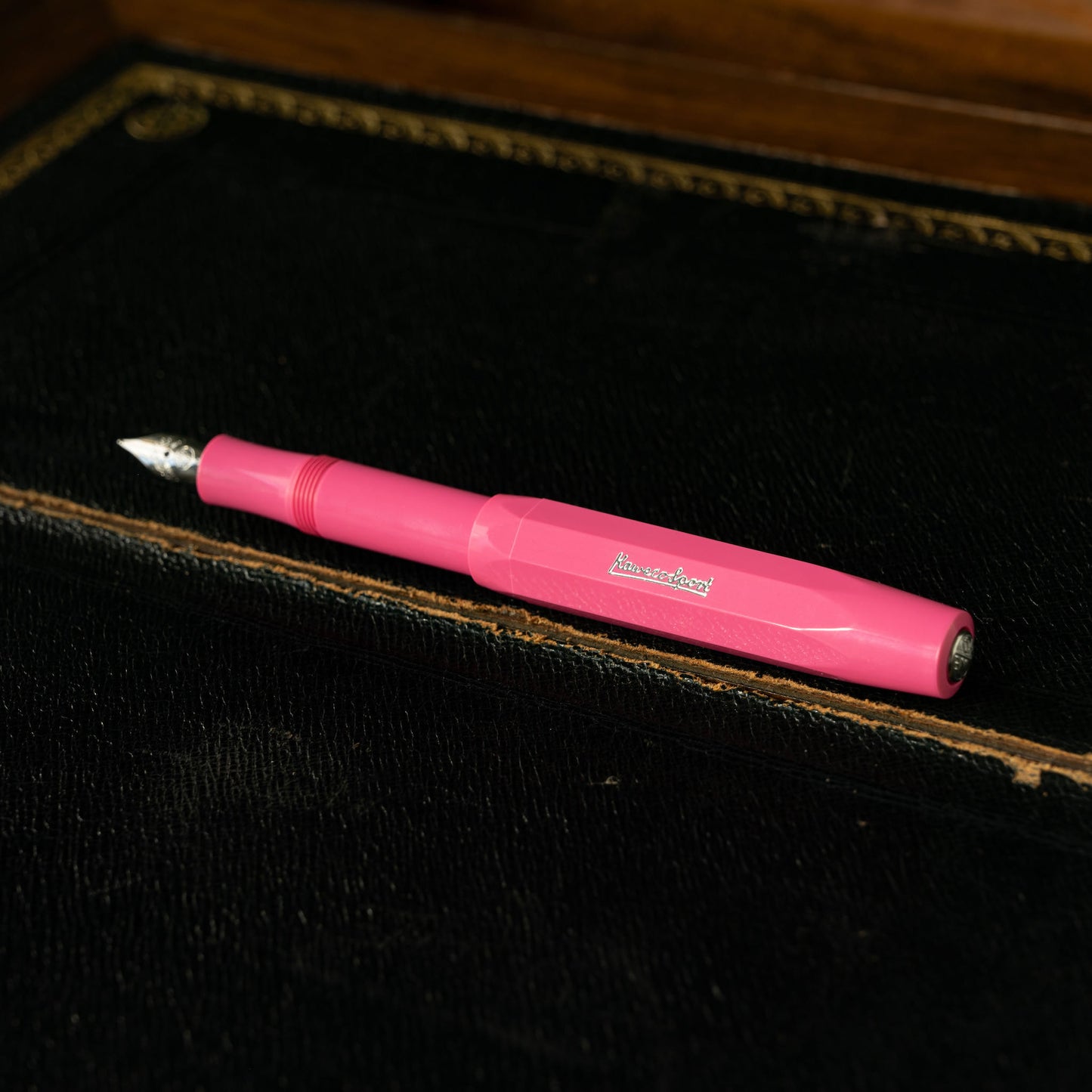 Kaweco Skyline Sport Pink Fountain Pen with the lid attached to the end of the barrel