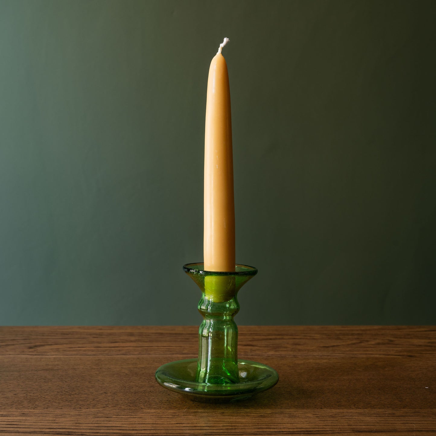 La Soufflerie small candlestick in green recycled glass with beeswax dinner candle.
