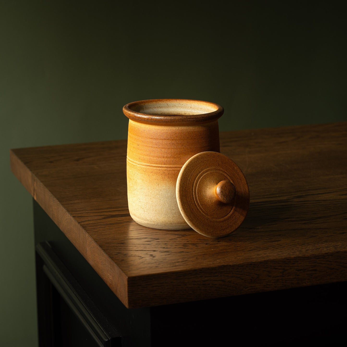 Muchelney Pottery medium stoneware storage jar with lid off.