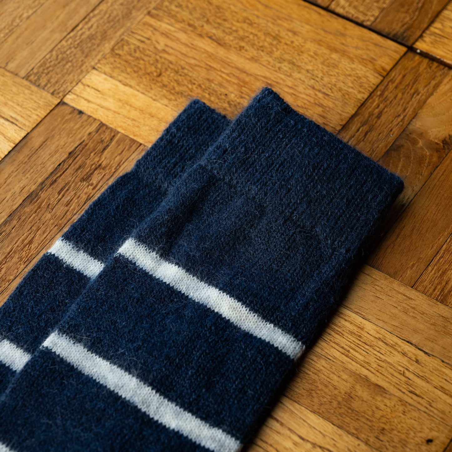 Nishiguchi Kutsushita Mohair Wool Border Socks in Navy with white horizontal stripes. Cuff detail.