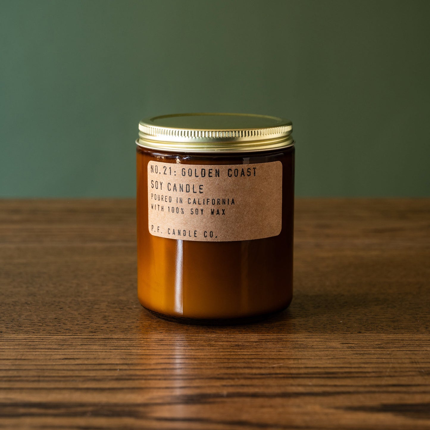PF Candle Co Golden Coast soy wax candle in amber jar.