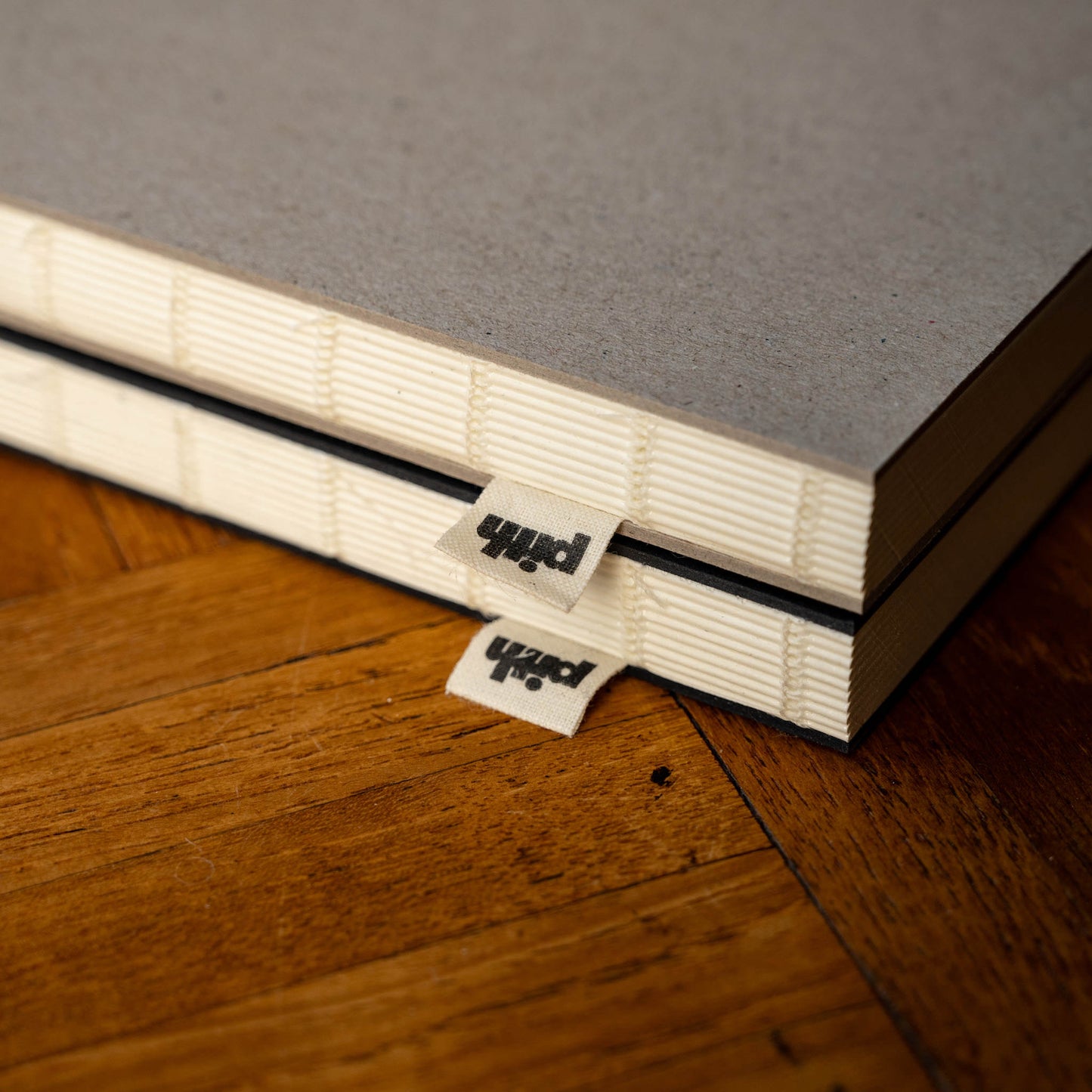 Pith Pomelo Notebook flat lay binding and woven label