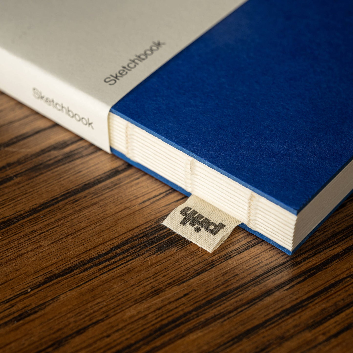 Pith Supply Blue Tangelo Sketchbook binding & woven label.