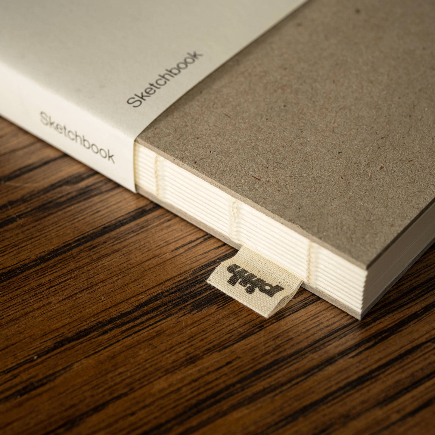 Pith Supply Raw Tangelo Sketchbook binding & woven label.