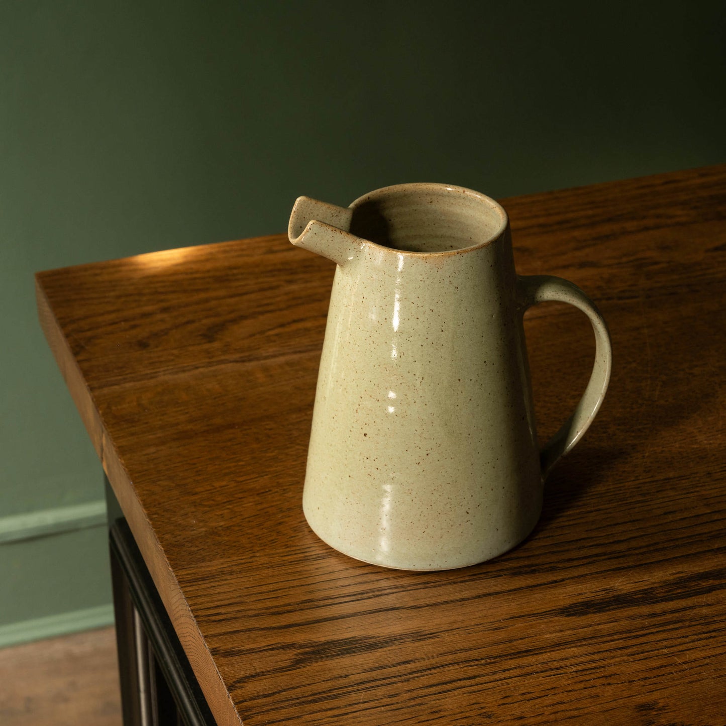 Pottery West stoneware jug in olive glaze.