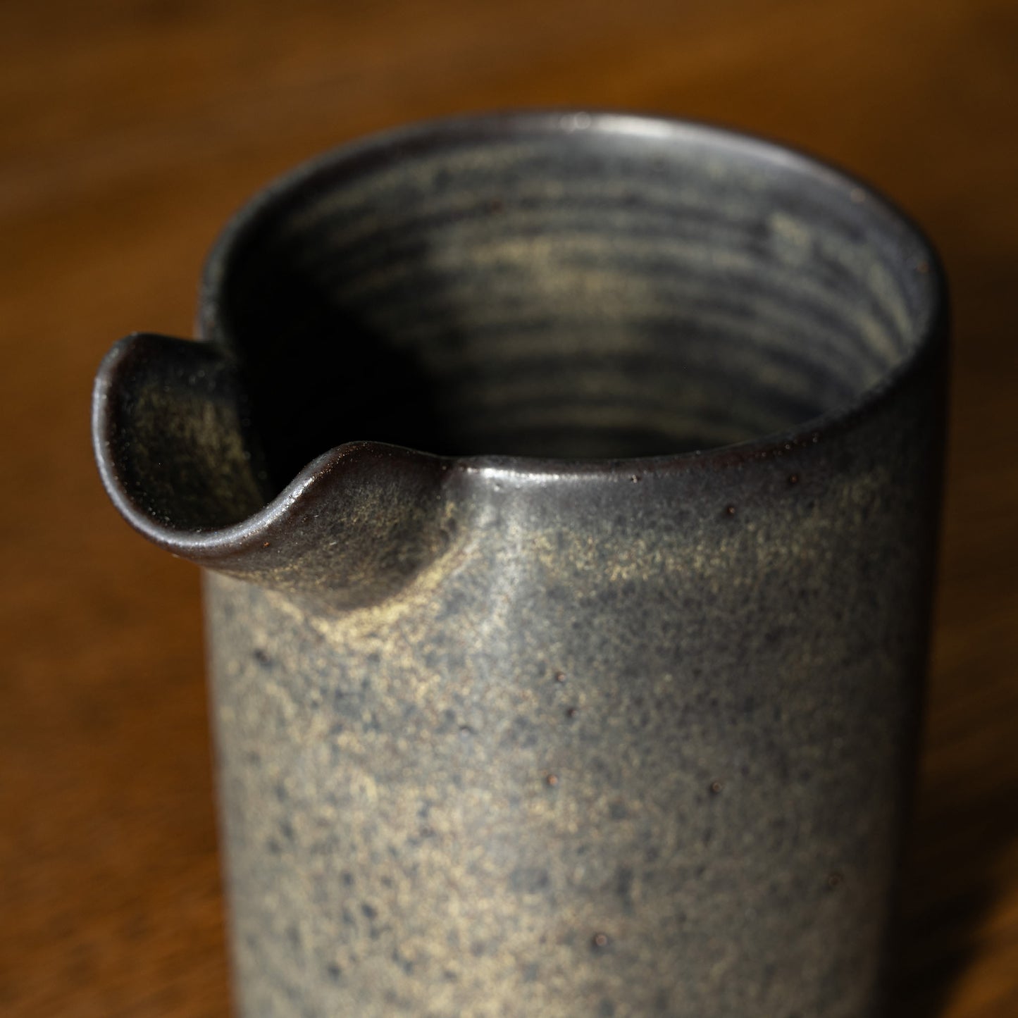 Spout & inside view of Pottery West Stoneware Pourer in charcoal glaze.