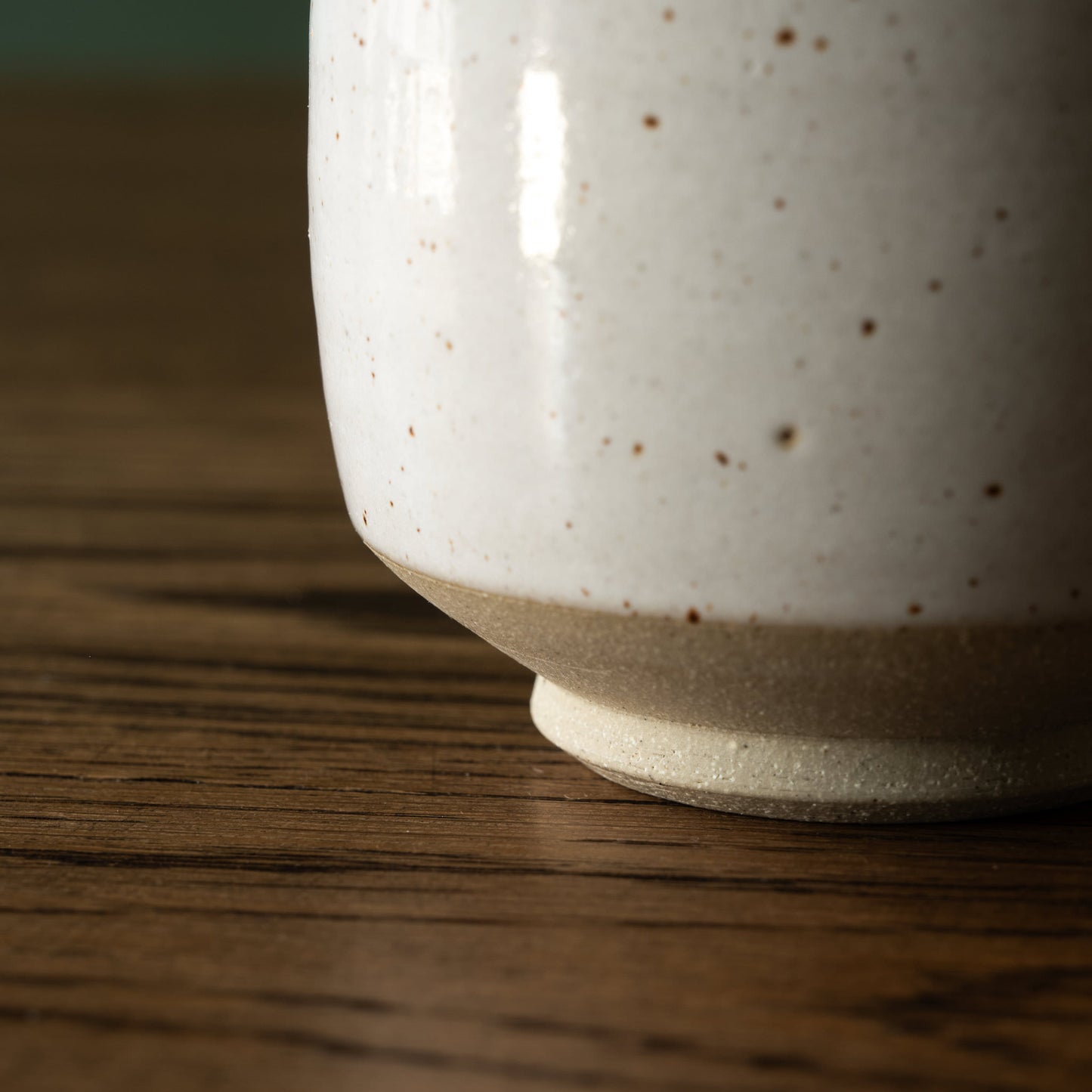 Close up of Pottery West Speckled White cup glaze