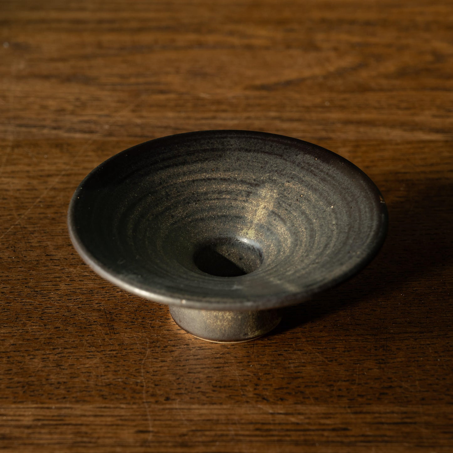 Pottery West stoneware dinner candle holder in charcoal glaze.