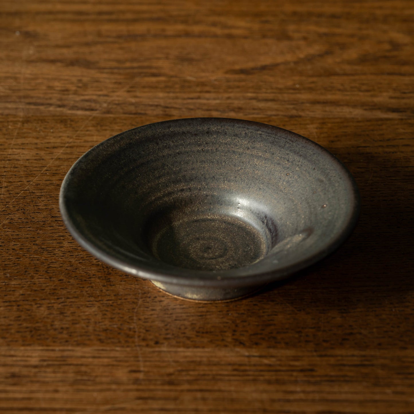 Pottery West stoneware stumpie candle holder in charcoal glaze.