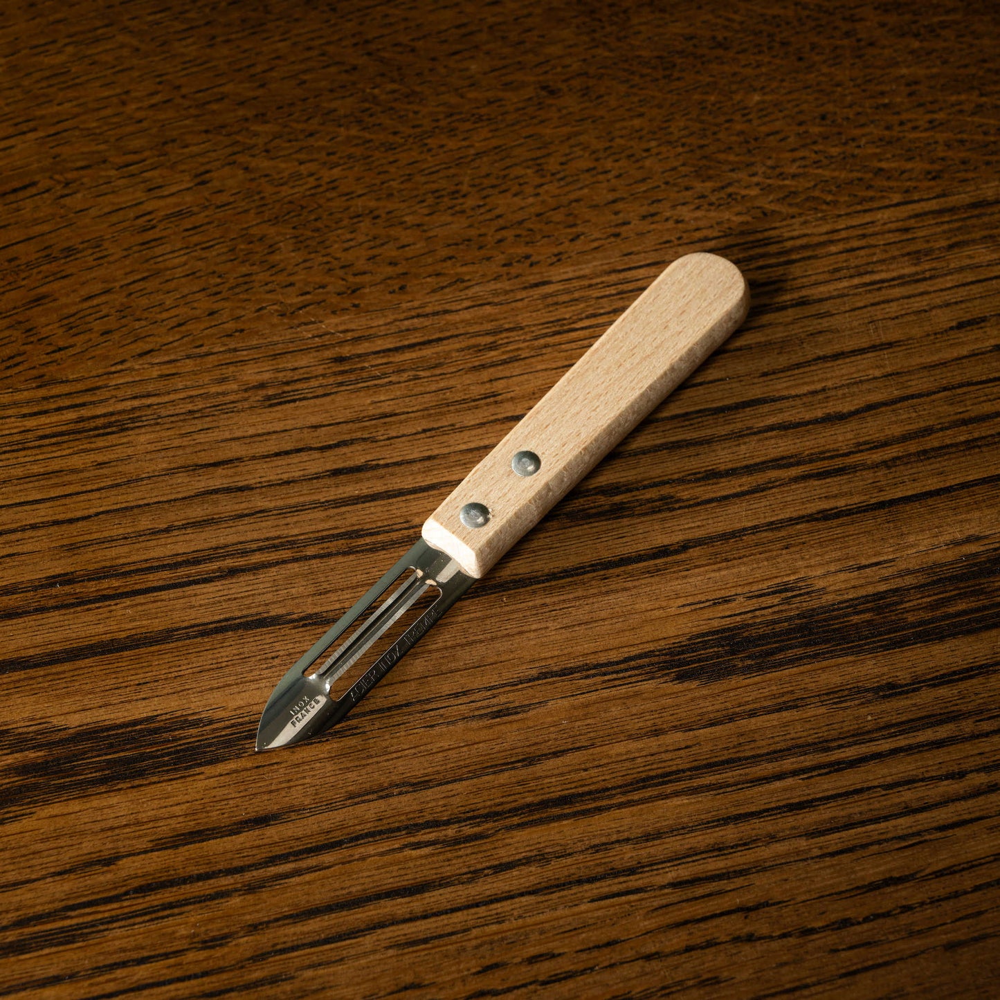 Vegetable peeler with natural wooden handle