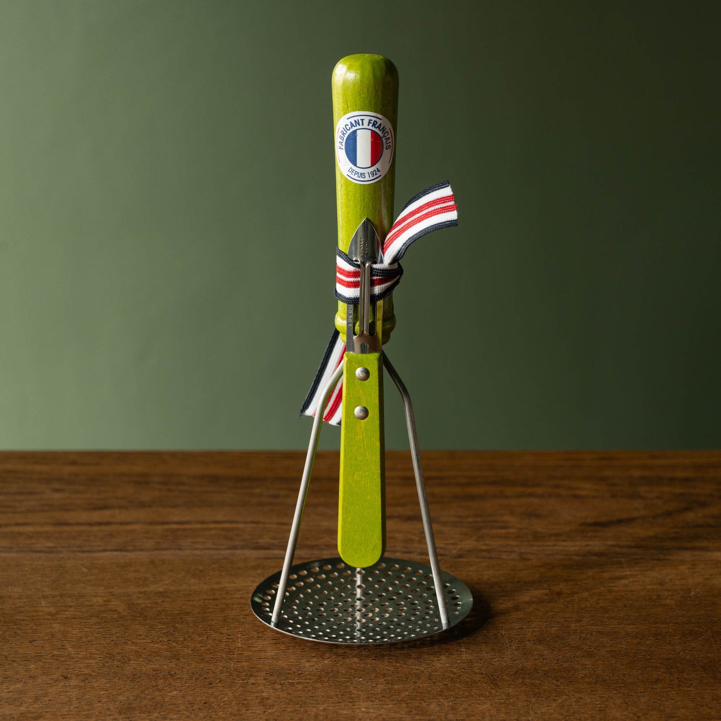 Roger Orfevre Potato masher & peeler set with lime green coloured wooden handles.