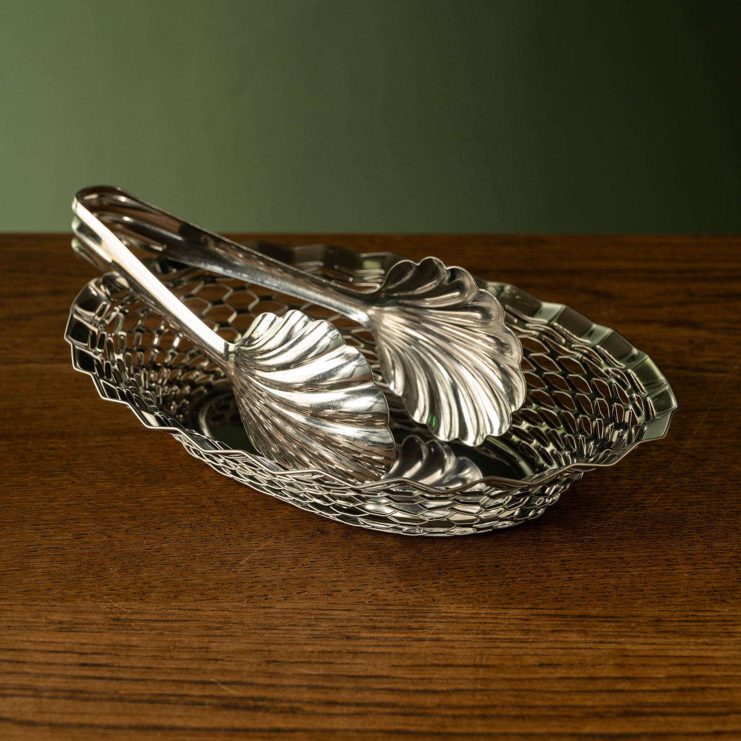 Stainless steel bakery tongs & oval basket.