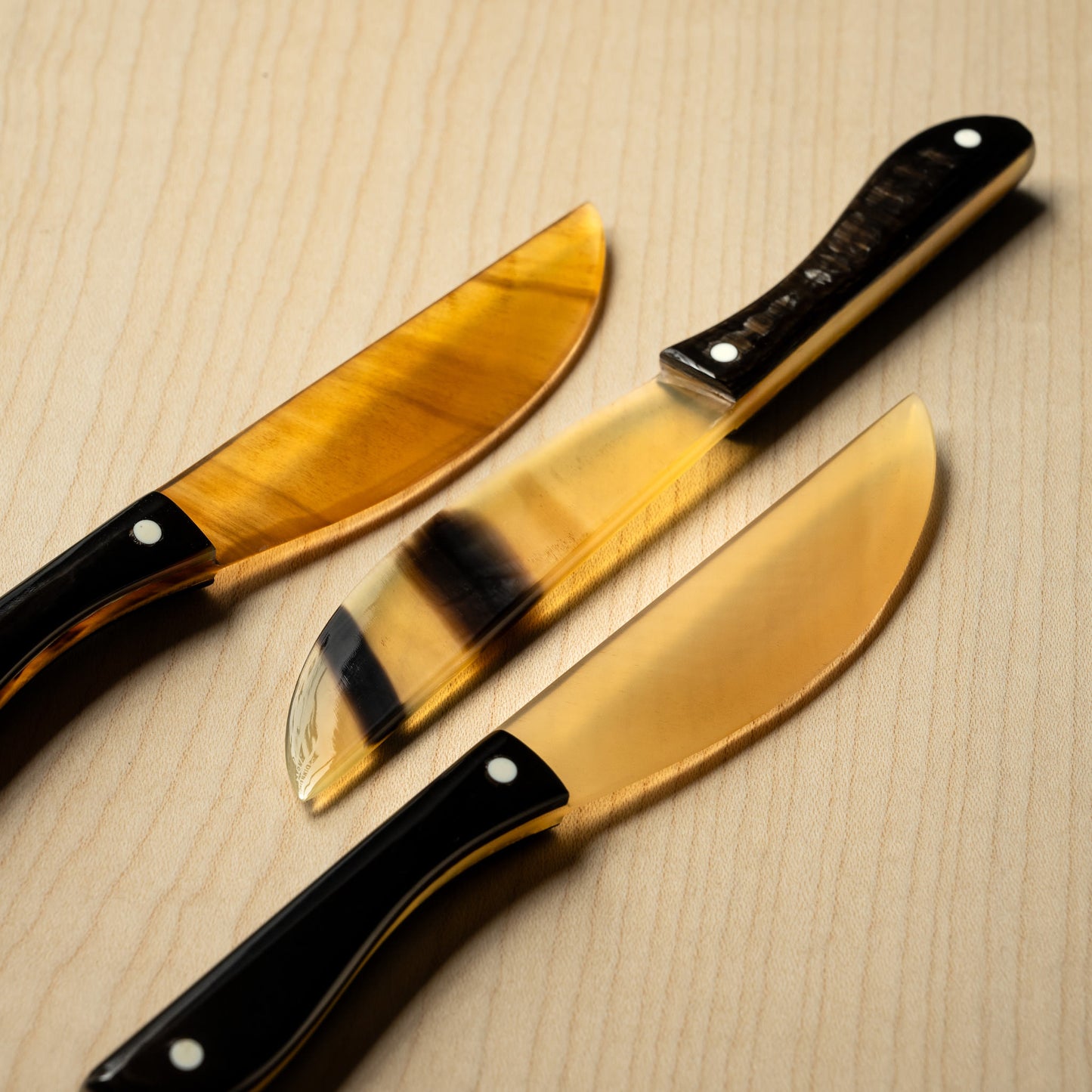 Selection of Sarah Petherick Chunky Butter Knives in Black & Natural Horn.
