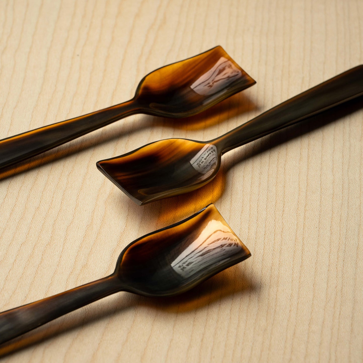 Assortment of Sarah Petherick Flame Horn Ice Cream / Caviar Spoons.