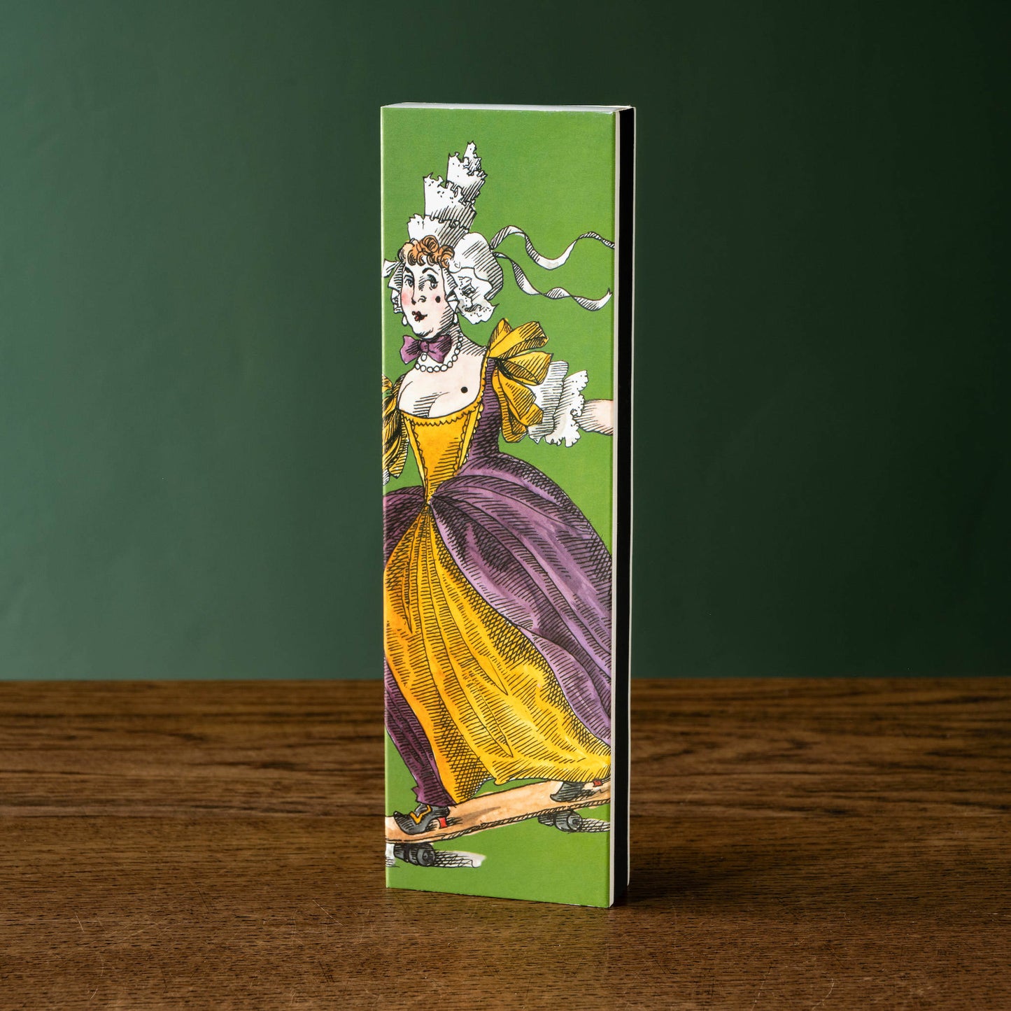 Trudon Ernesto scented matches in a Decorative box with a vintage-style illustration of a woman in a yellow and purple dress on a green background.