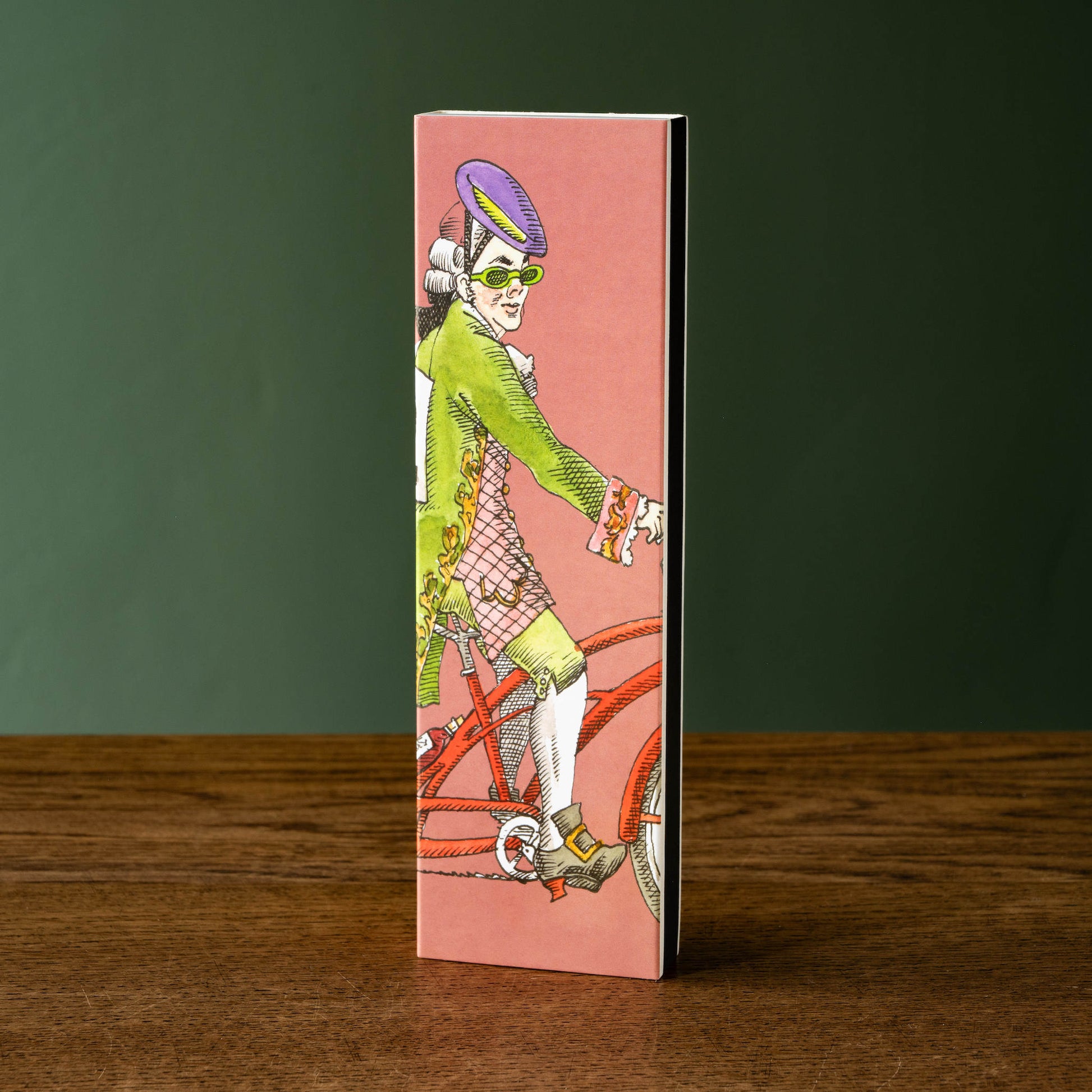 Trudon Ernesto scented matches in a Decorative box with a vintage-style illustration of a person on a bicycle against a pink background