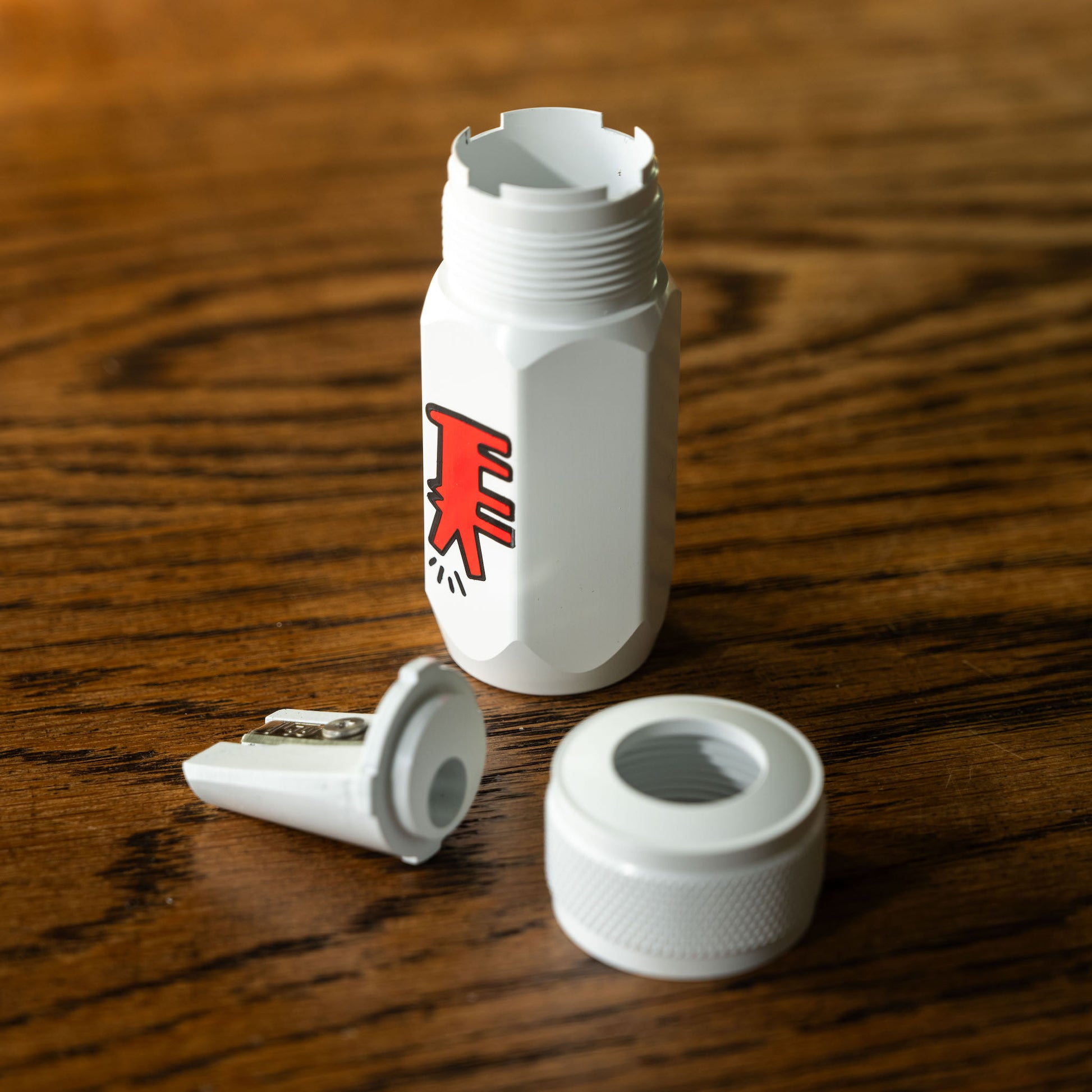 Blackwing Volume 292 Keith Haring Long Point Sharpener showing steel blade sharping section and screw cap. 