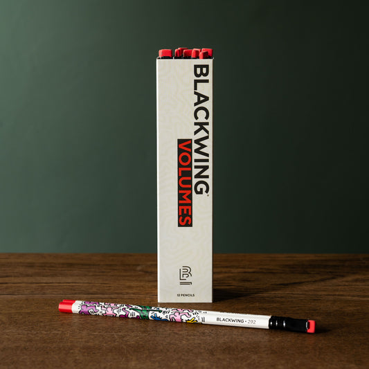 Blackwing Volumes 292 Keith Haring pencils and box on a wooden surface 