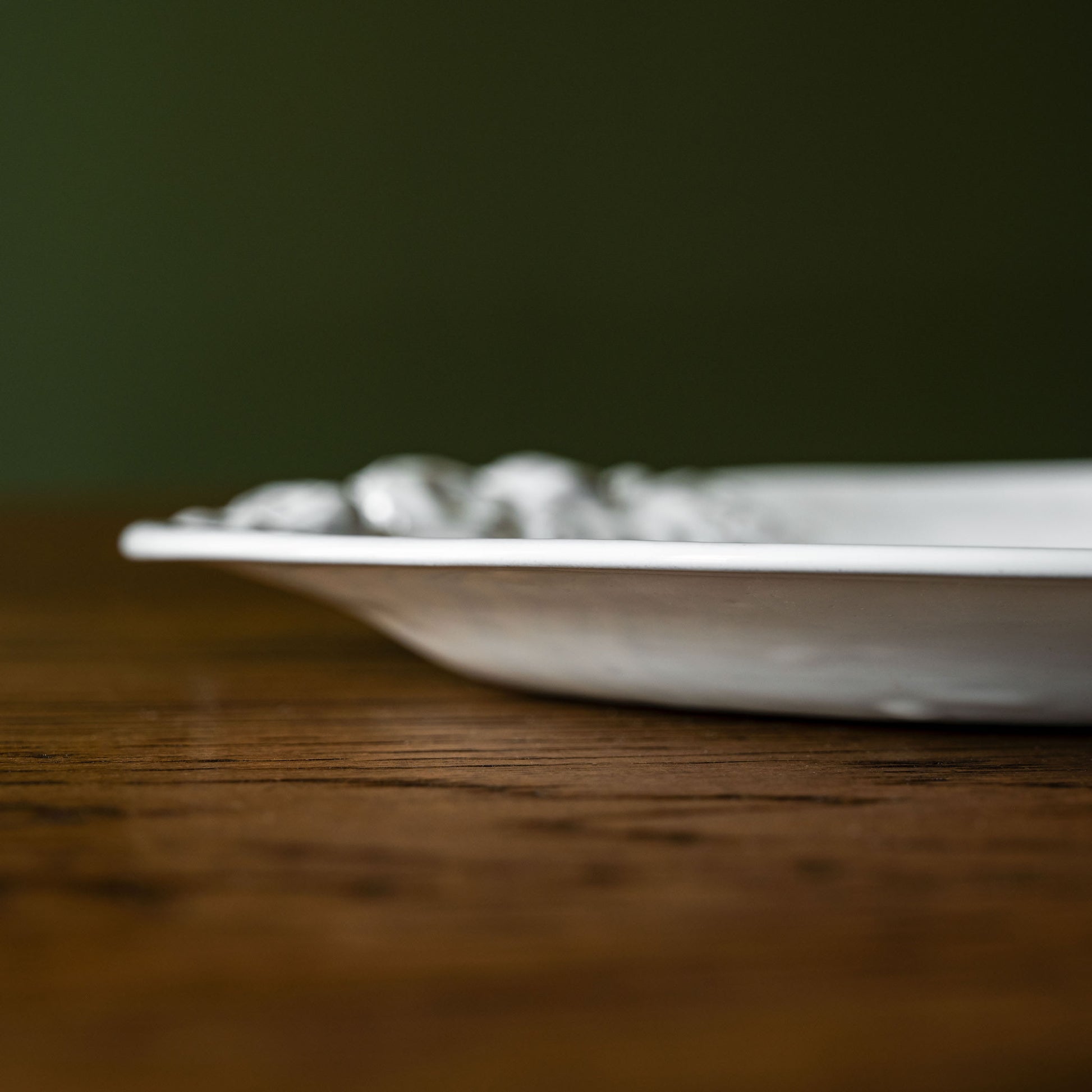 Side profile of Carron Paris Rose Dessert Plate. 