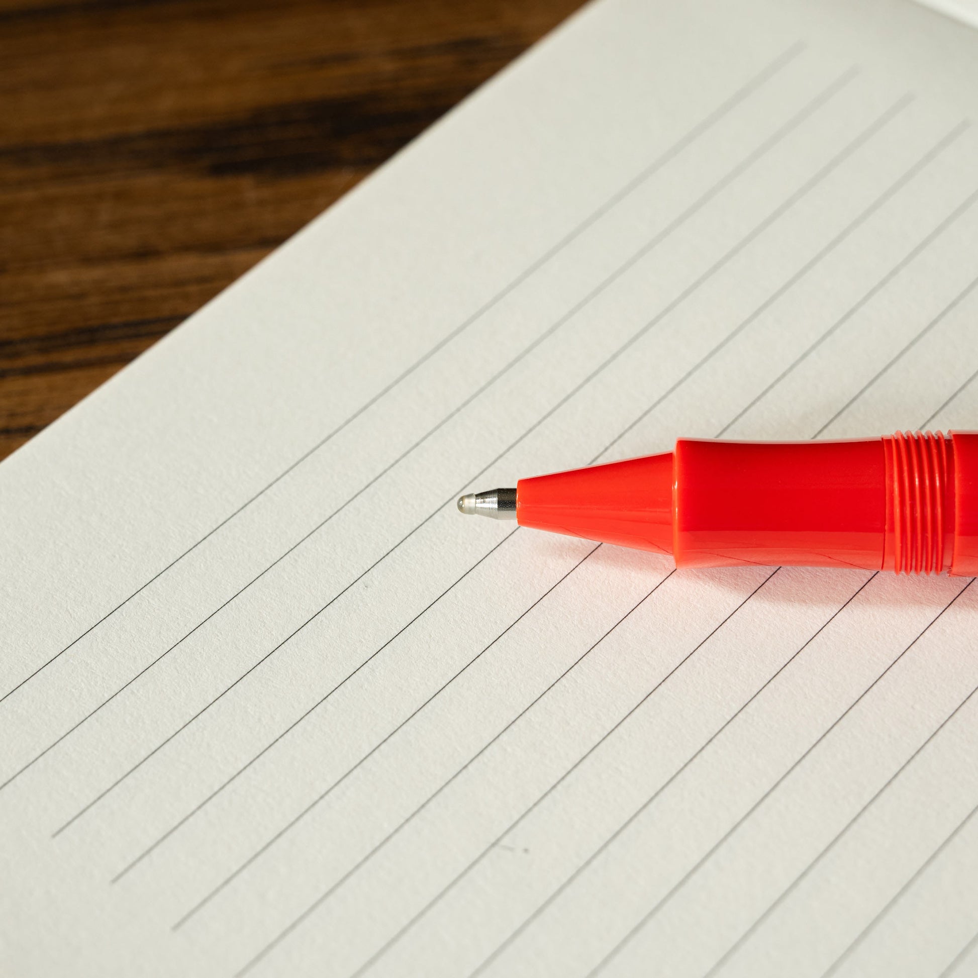 Kaweco Sport Red Rollerball nib on lined notebook paper