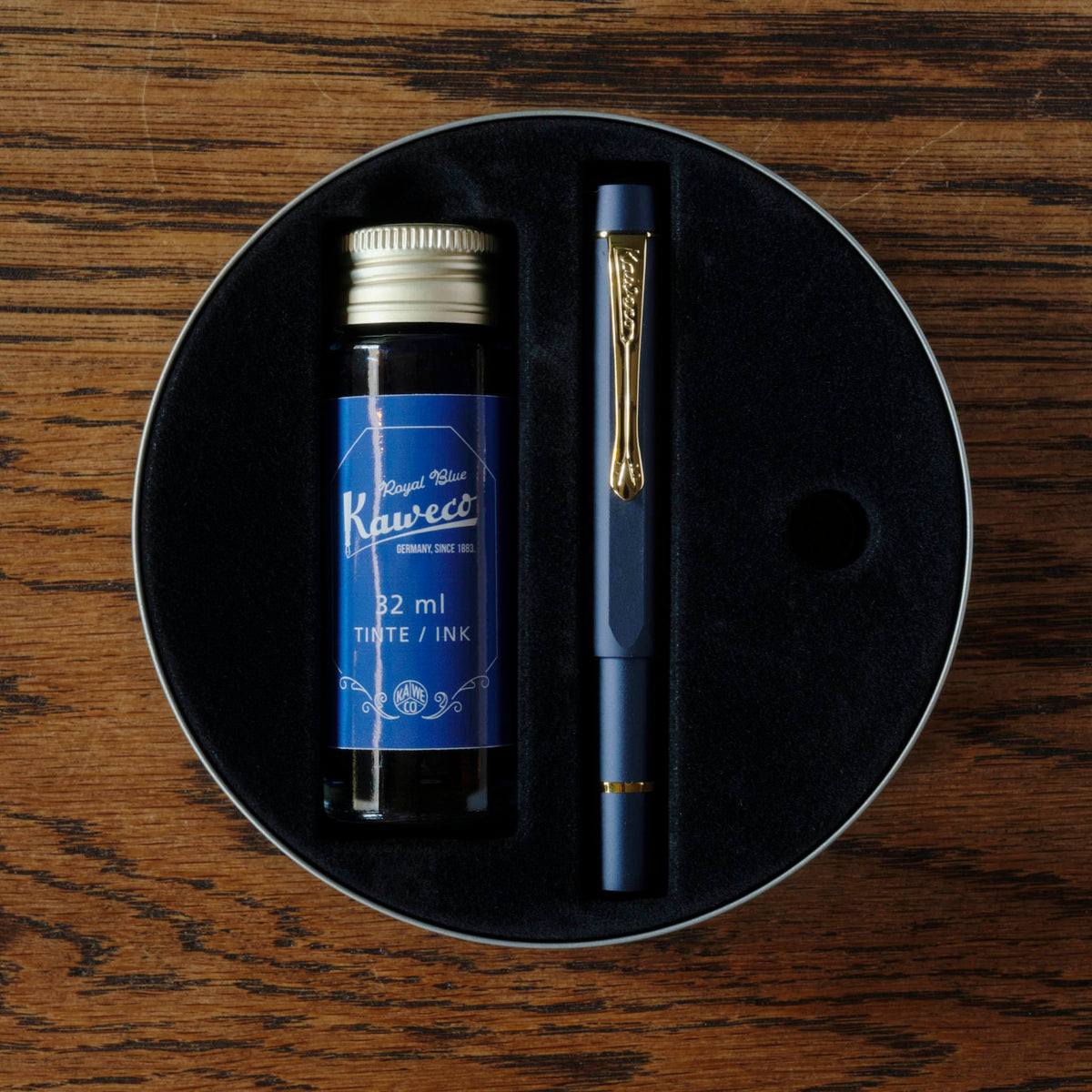 Kaweco Piston Sport AL Starter Pack of a Navy Blue pen with a bottle of blue ink. 