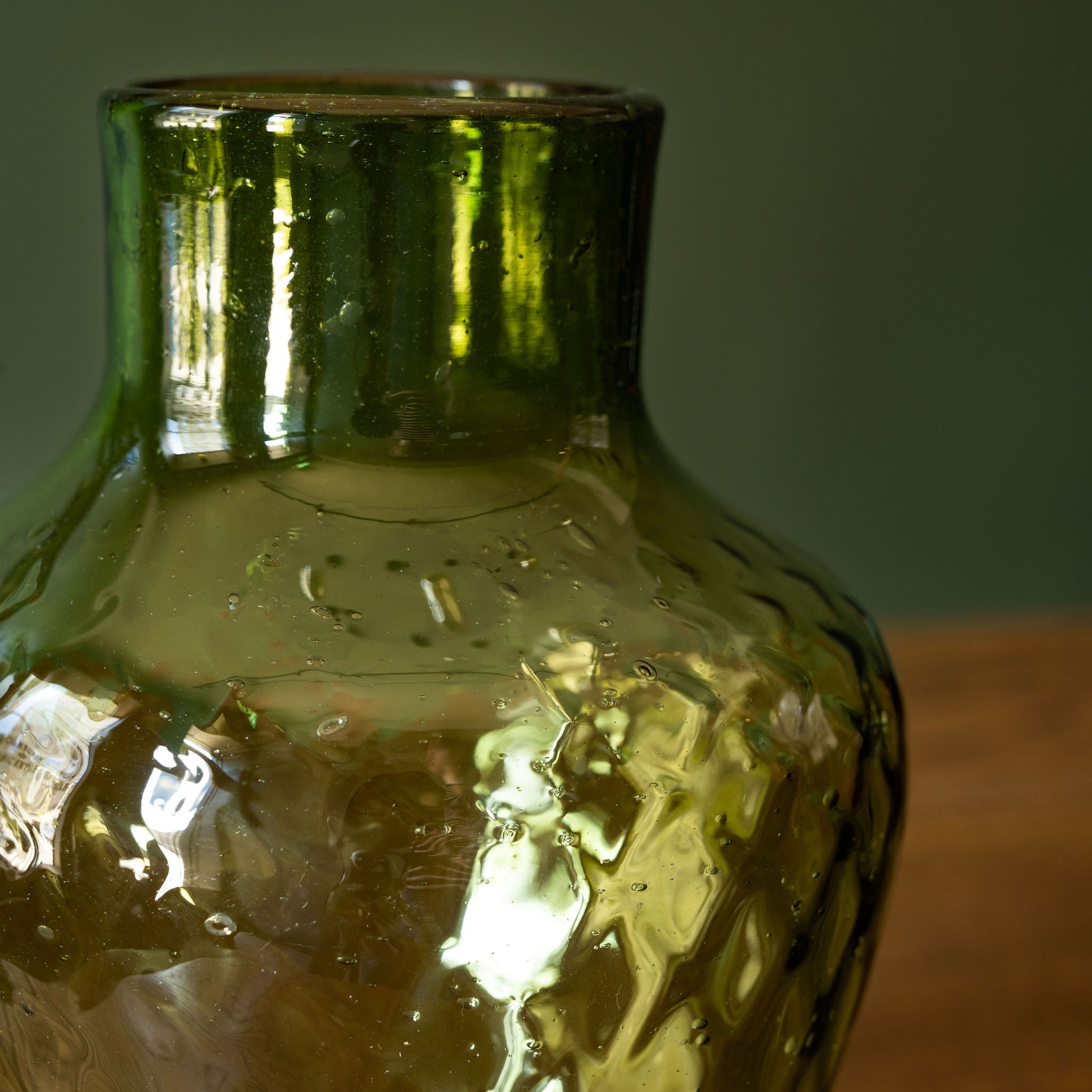 Neck of La Soufflerie Dolia Glass Vase in dark green recycled glass. 