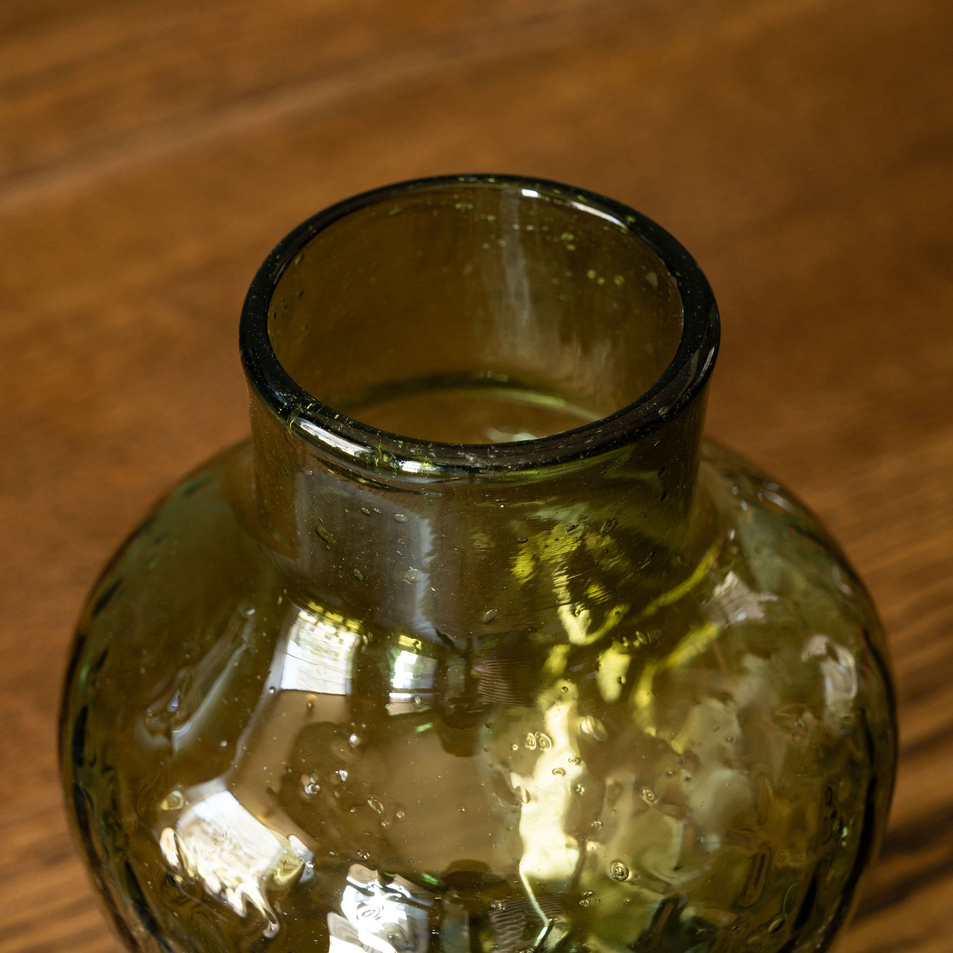 Top view of La Soufflerie Dolia Glass Vase in dark green recycled glass. 