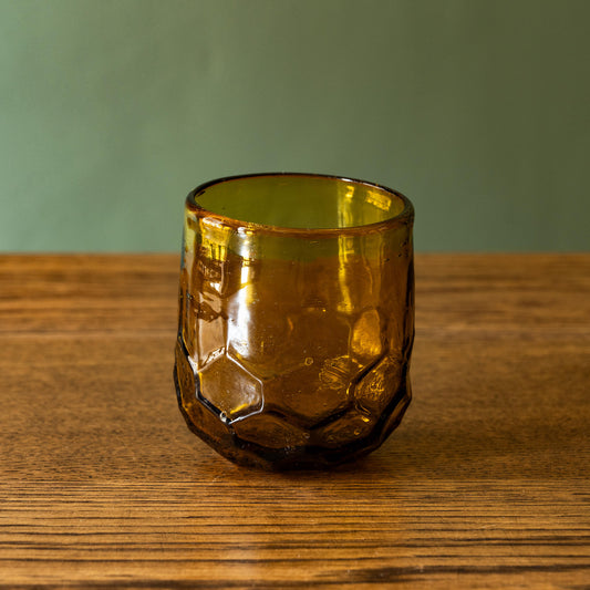 La Soufflerie Melissa amber glass tumbler with honeycomb design. 