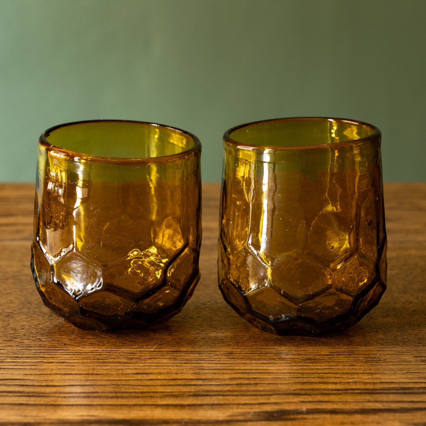 Pair of La Soufflerie Melissa recycled glass tumblers in amber. 
