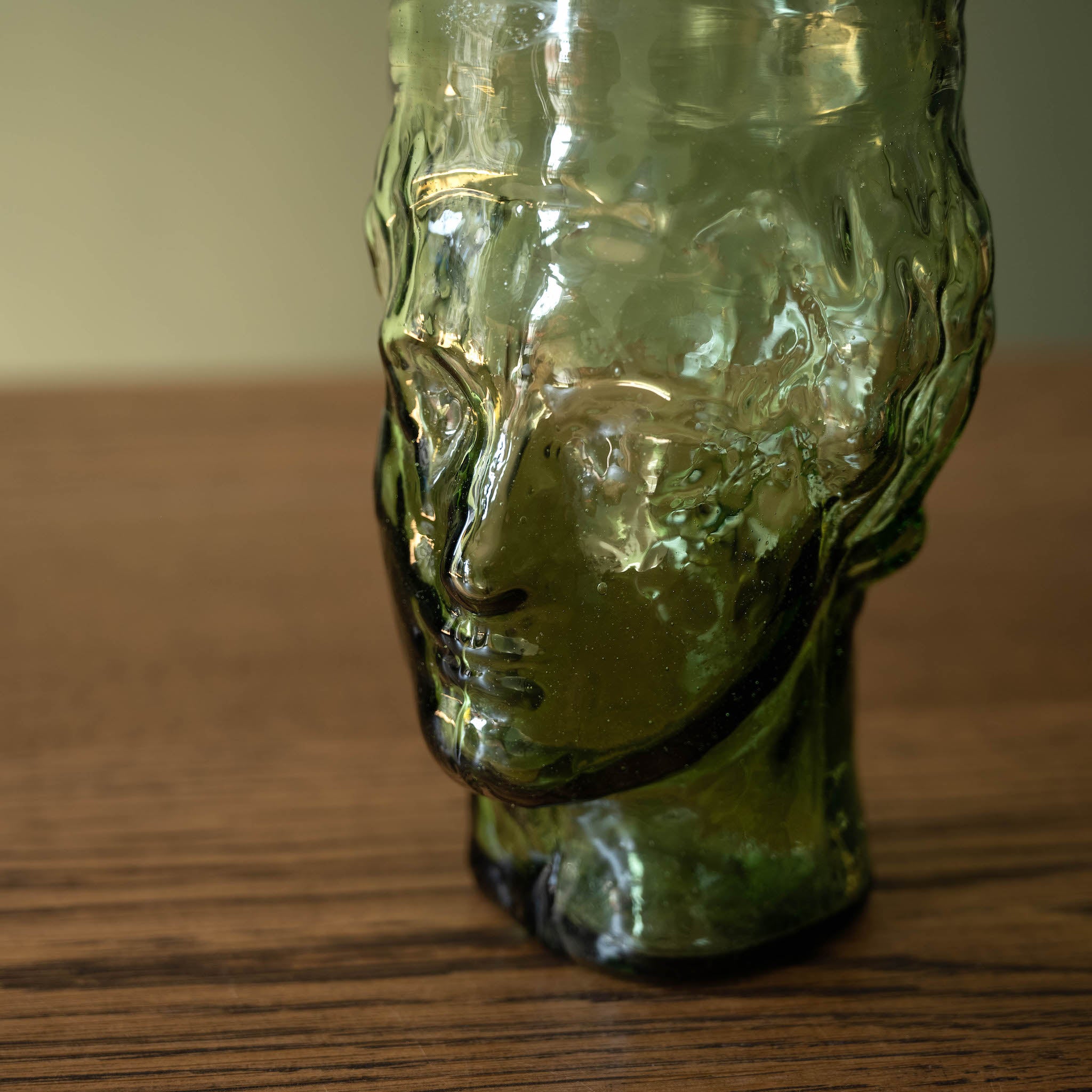 Close up of La Soufflerie Roma Vase Face in Green Recycled Glass