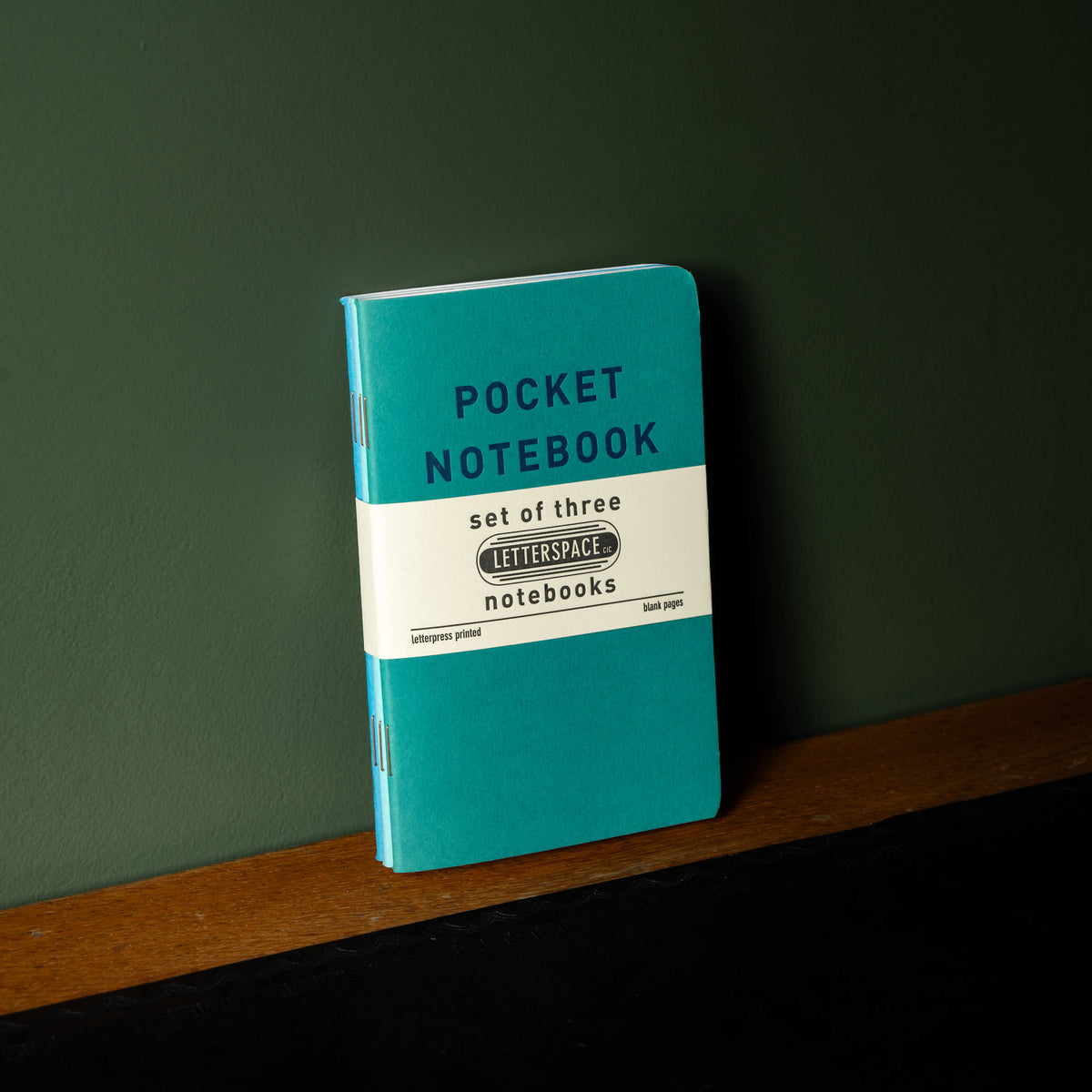 Set of 3 Letterpress pocket notebooks with individual covers in tones of blue 