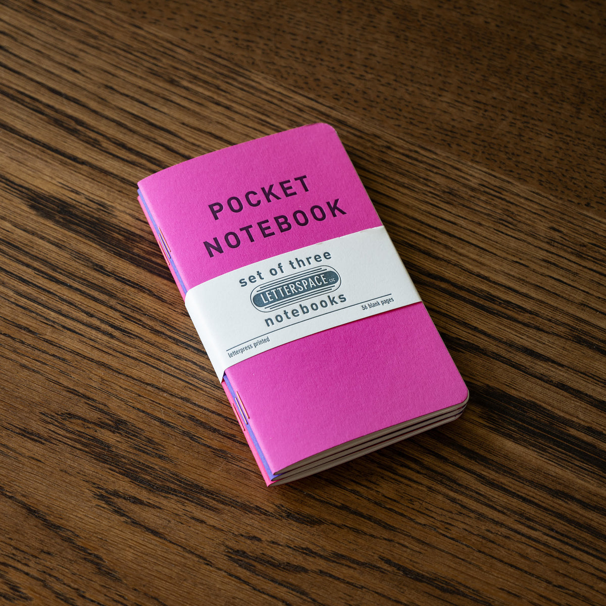 Set of 3 Letterpress pocket notebooks with individual covers in tones of pink. 