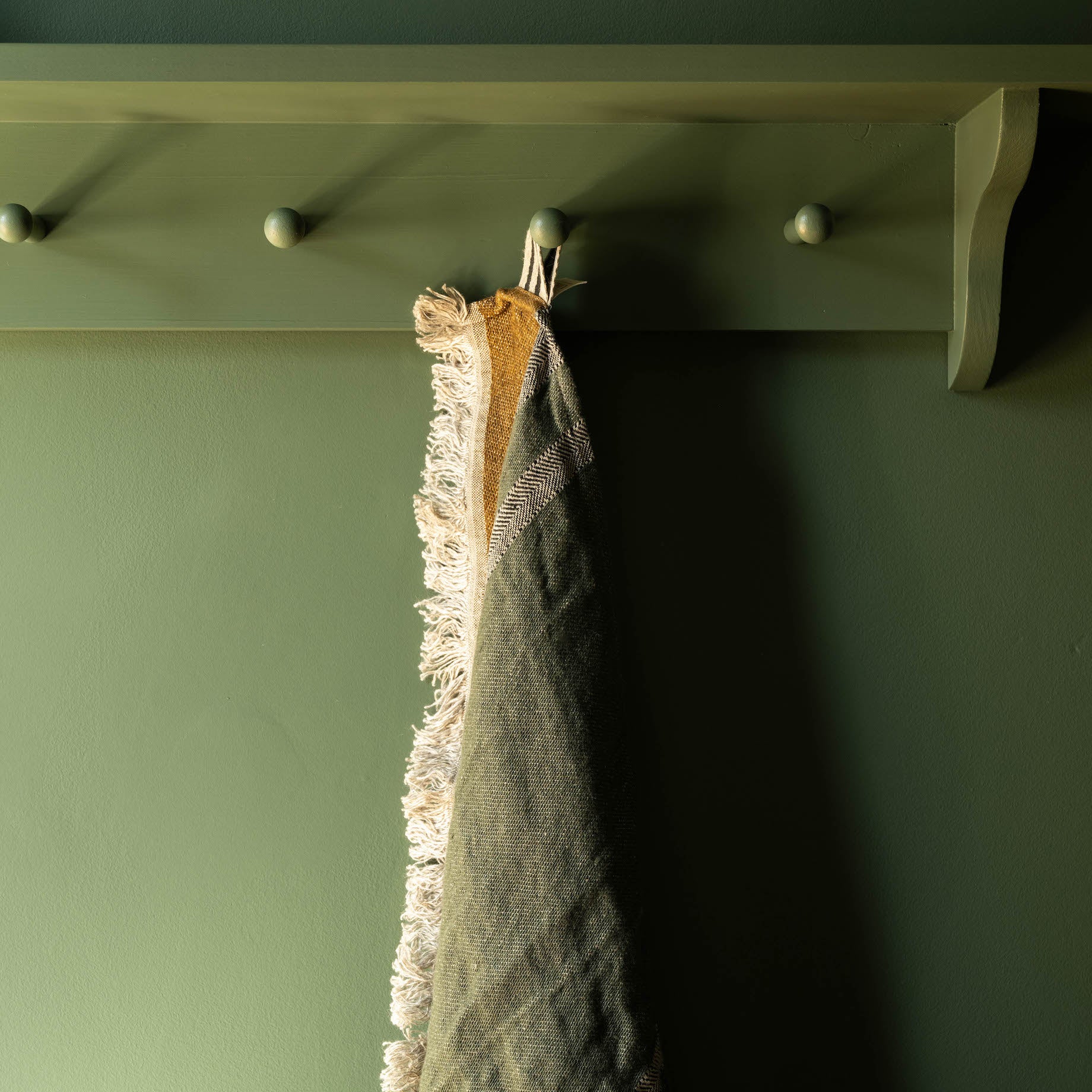 Libeco Alouette Belgian Guest Towel hanging up on peg rail