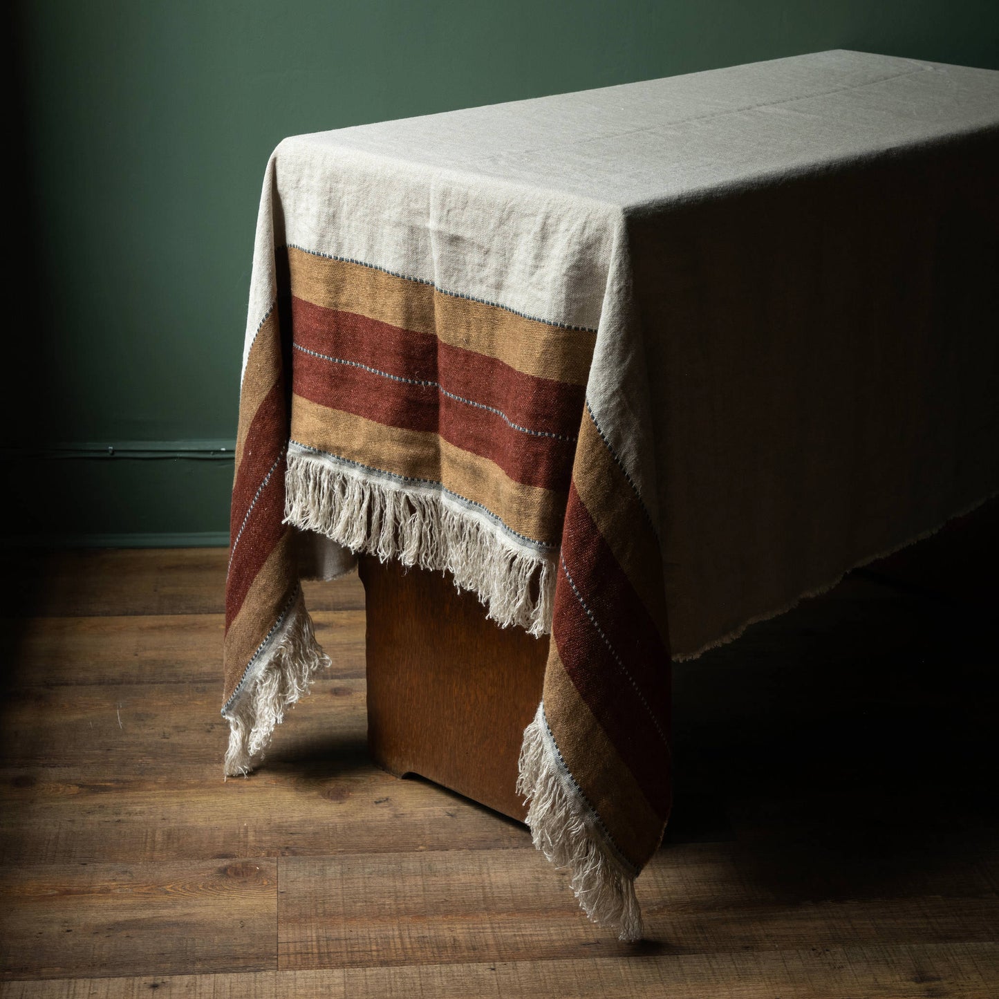 Libeco Belgian Linen Hillside Table Throw. Natural Flax colour with old rose & leather coloured stripes and fringed edge. 