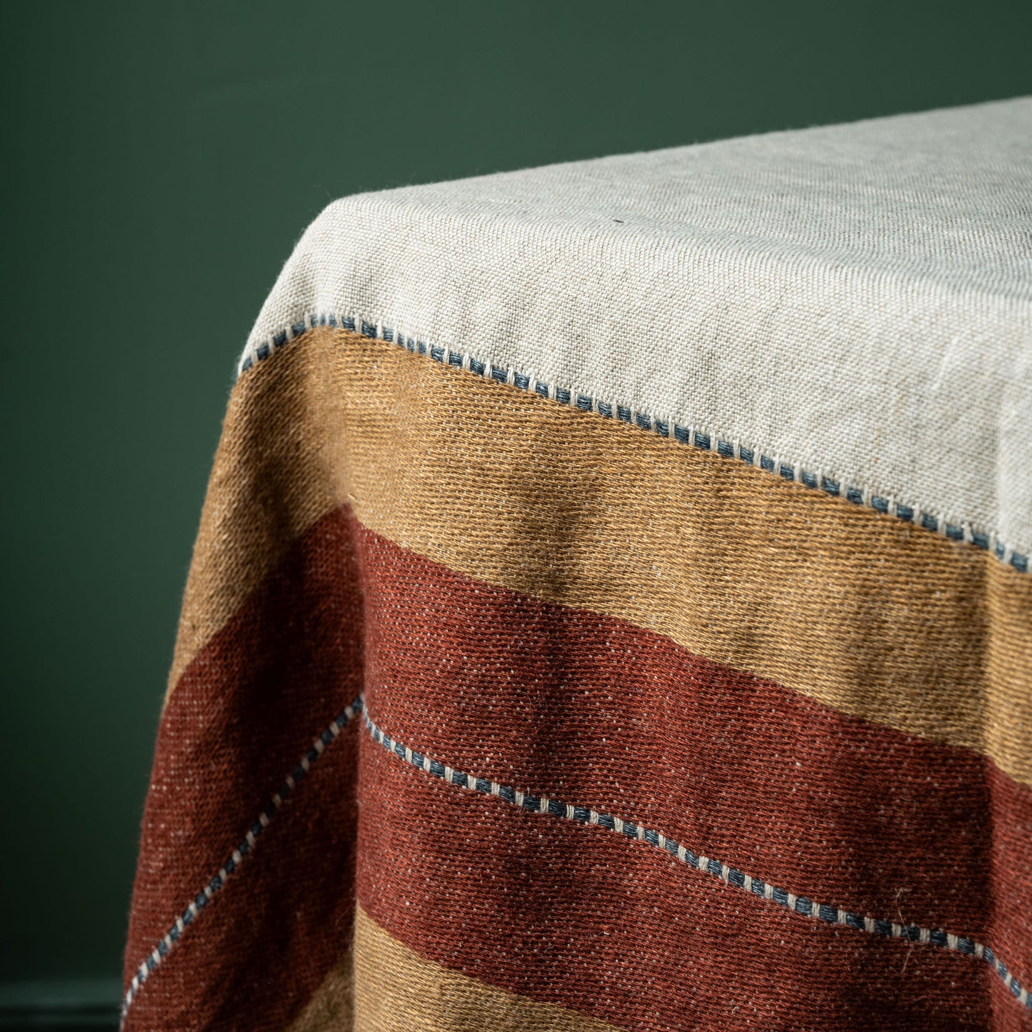 Close-up of a striped fabric detail of Libeco Hillside Linen table throw