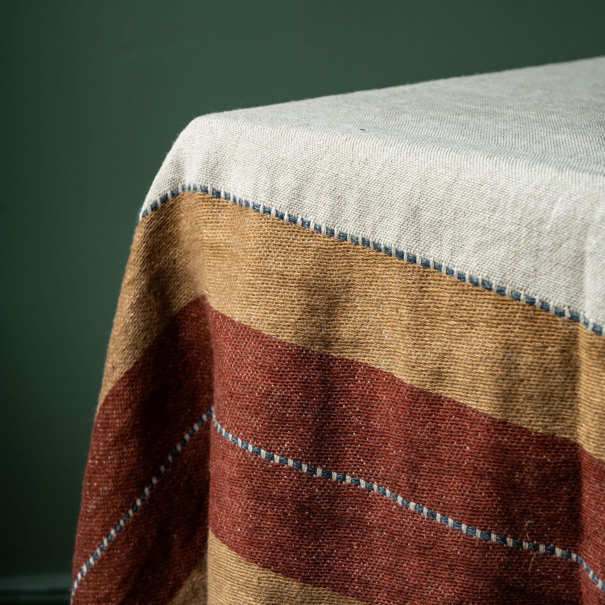 Close-up of a striped fabric detail of Libeco Hillside Linen table throw