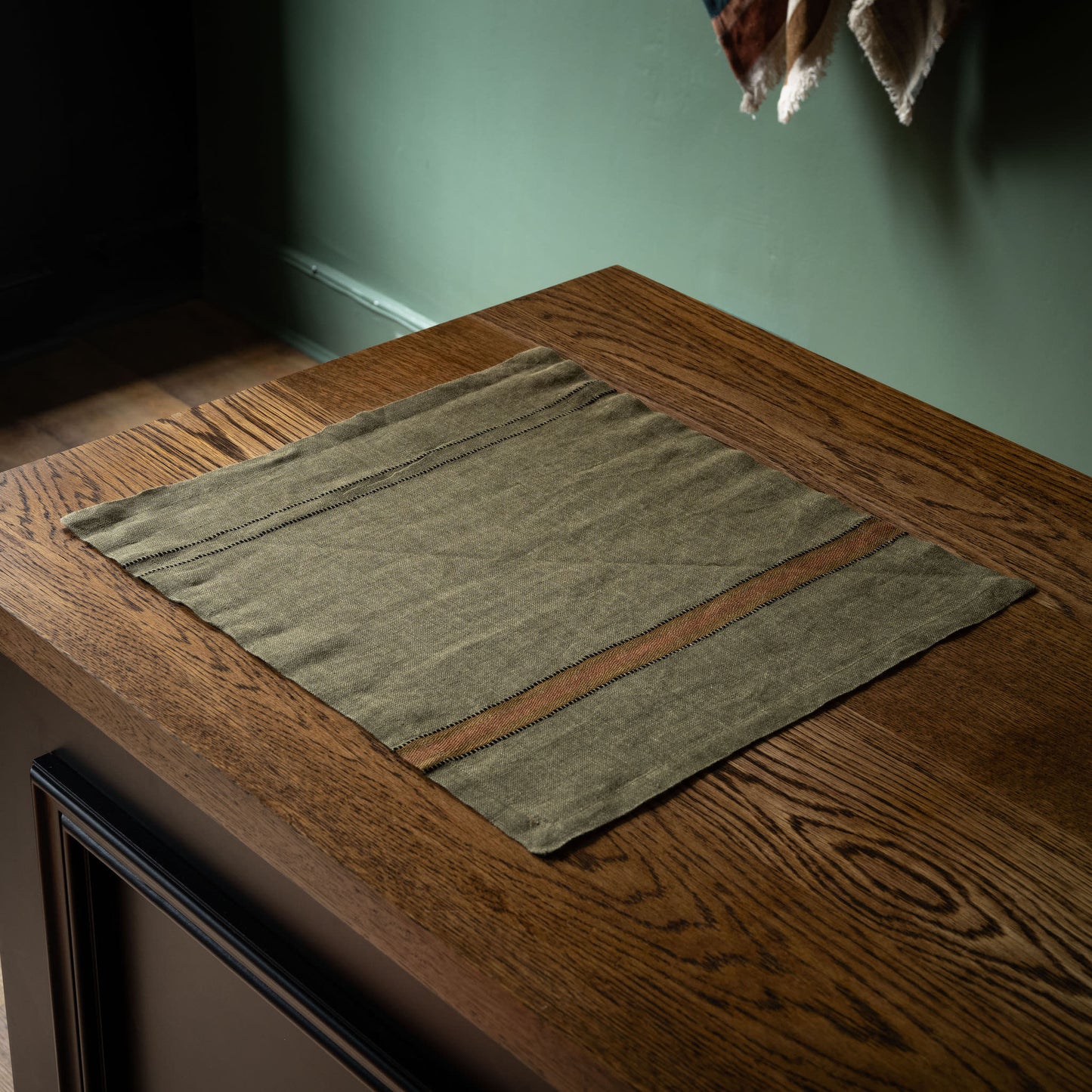 Libeco Belgian Linen Marie Napkin in green with striped designs at either end