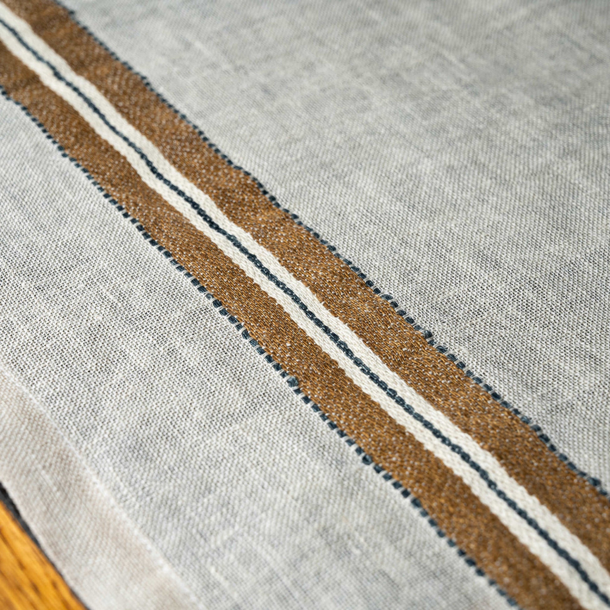 Close-up of Libeco Perry off white linen napkin with brown and white stripes 