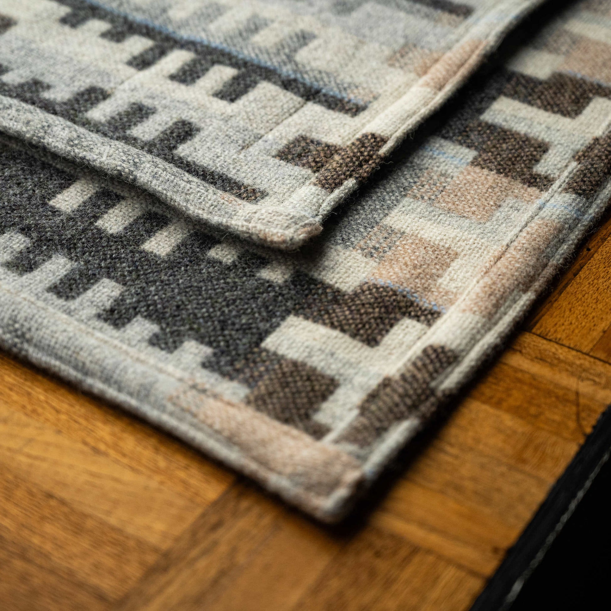 Weave and hem detail of Melin Tregwynt traditional double cloth Welsh Blanket in Forest design.